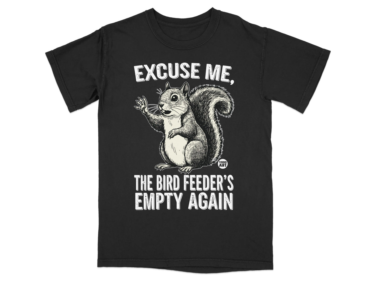T-shirt with a cartoon squirrel and text "EXCUSE ME, THE BIRD FEEDER'S EMPTY AGAIN".