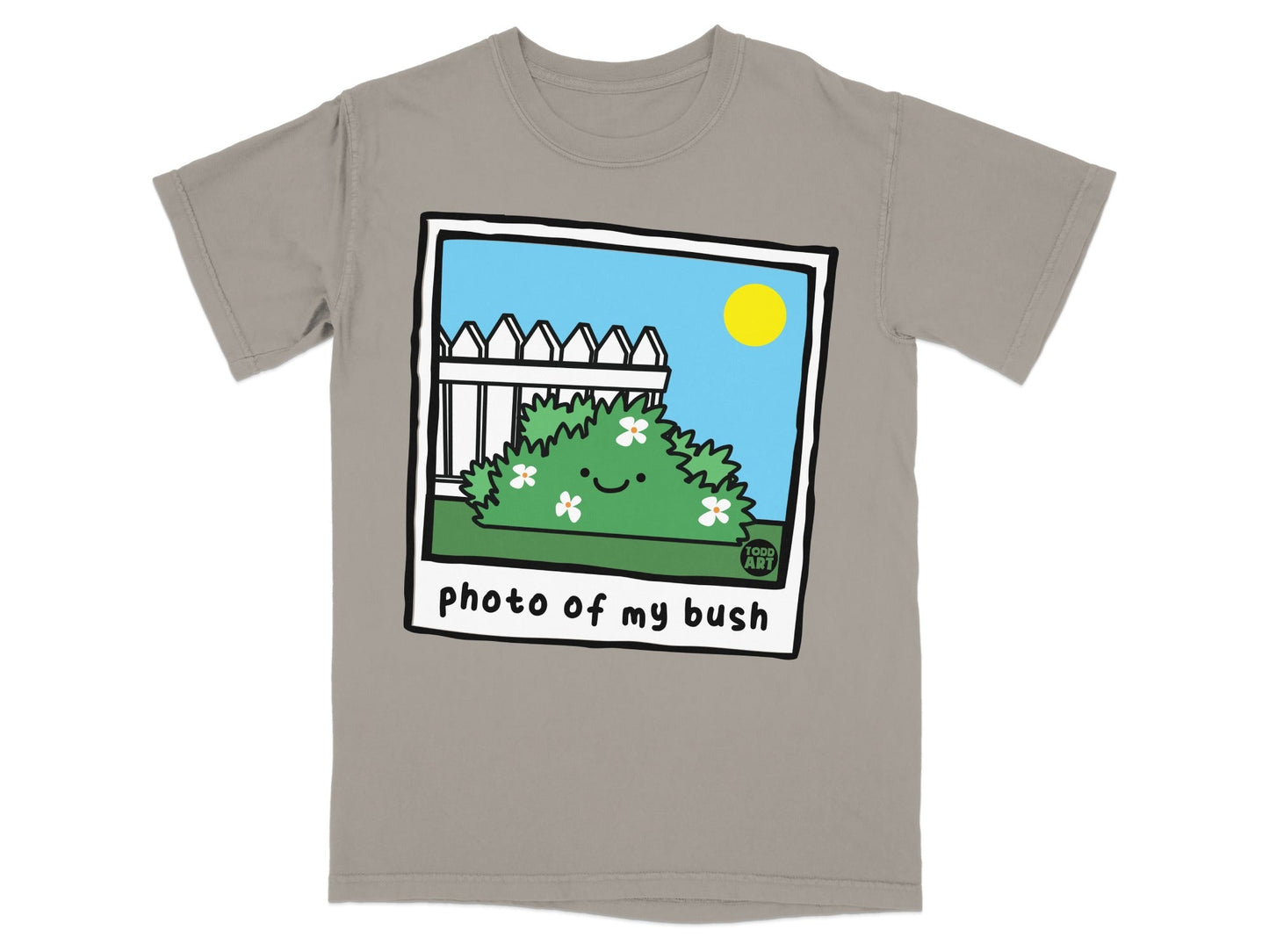 Cartoon bush with smiley face and flowers in a photo frame on a gray t-shirt.