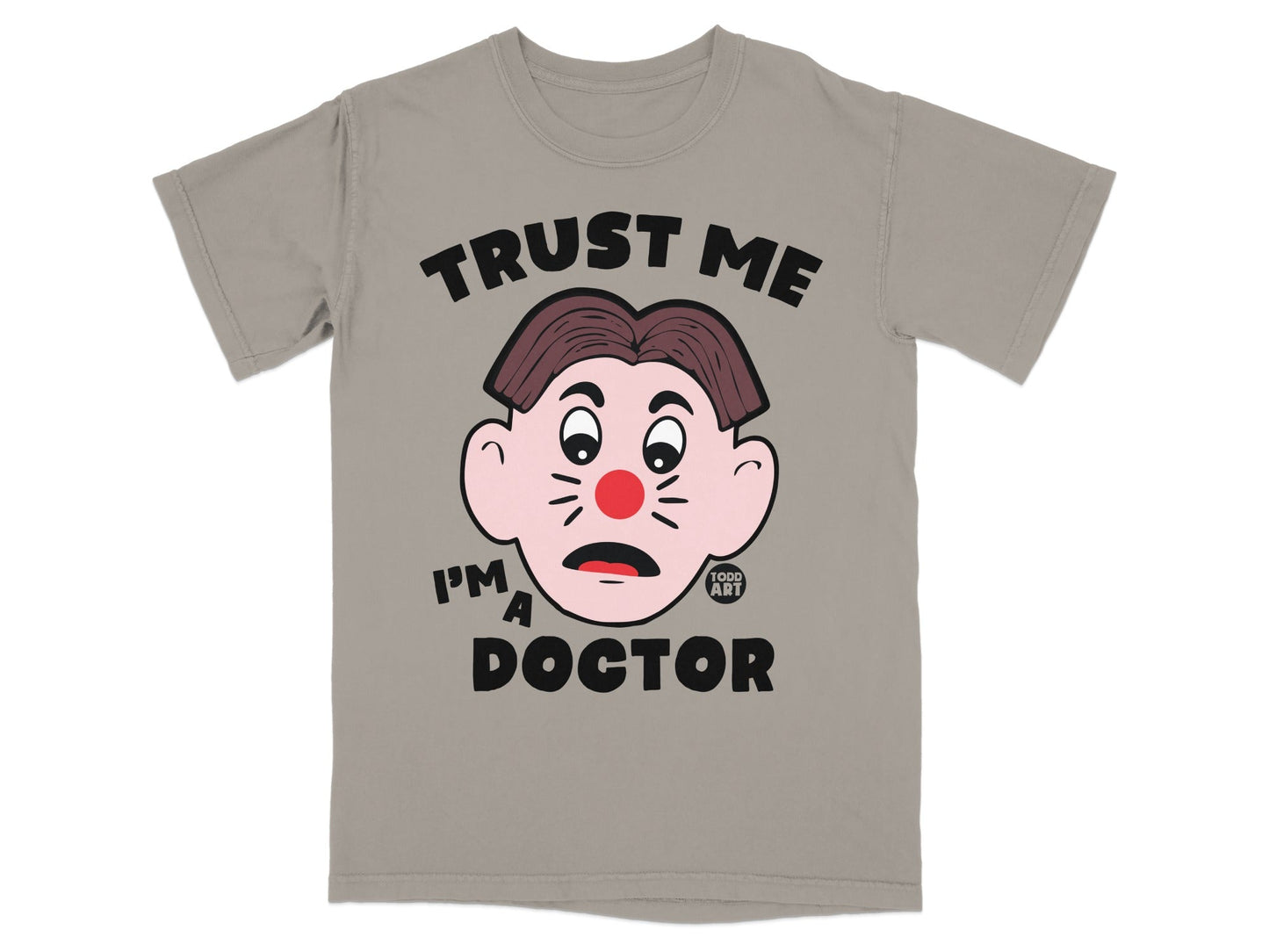 Gray t-shirt with cartoon face and text "TRUST ME I'M A DOCTOR".