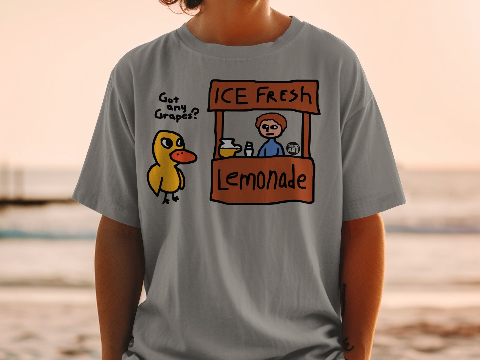 Cartoon duck with lemonade stand and "Got Any Grapes?" text.