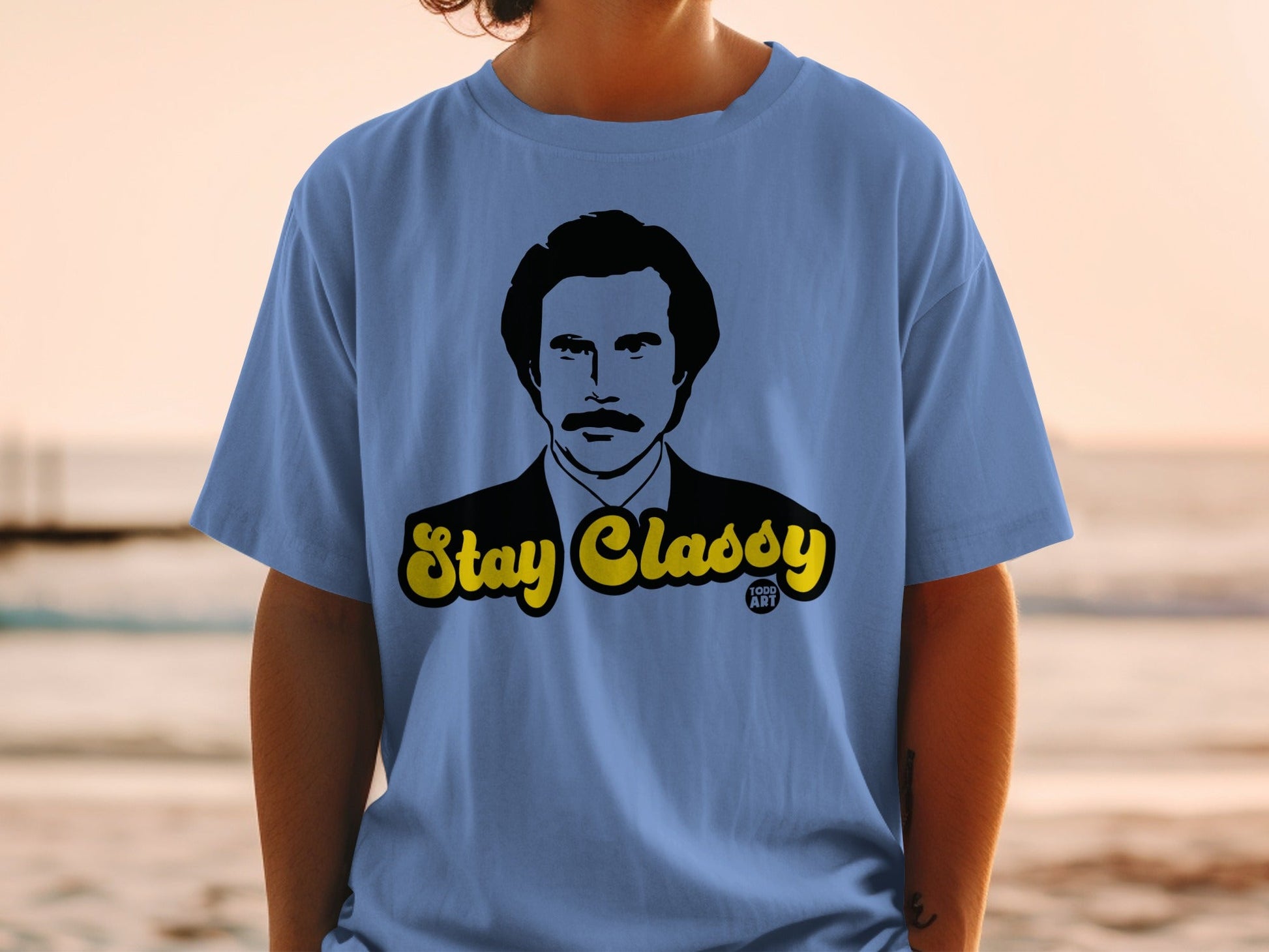 Light blue t-shirt with "Stay Classy" and Ron Burgundy graphic.