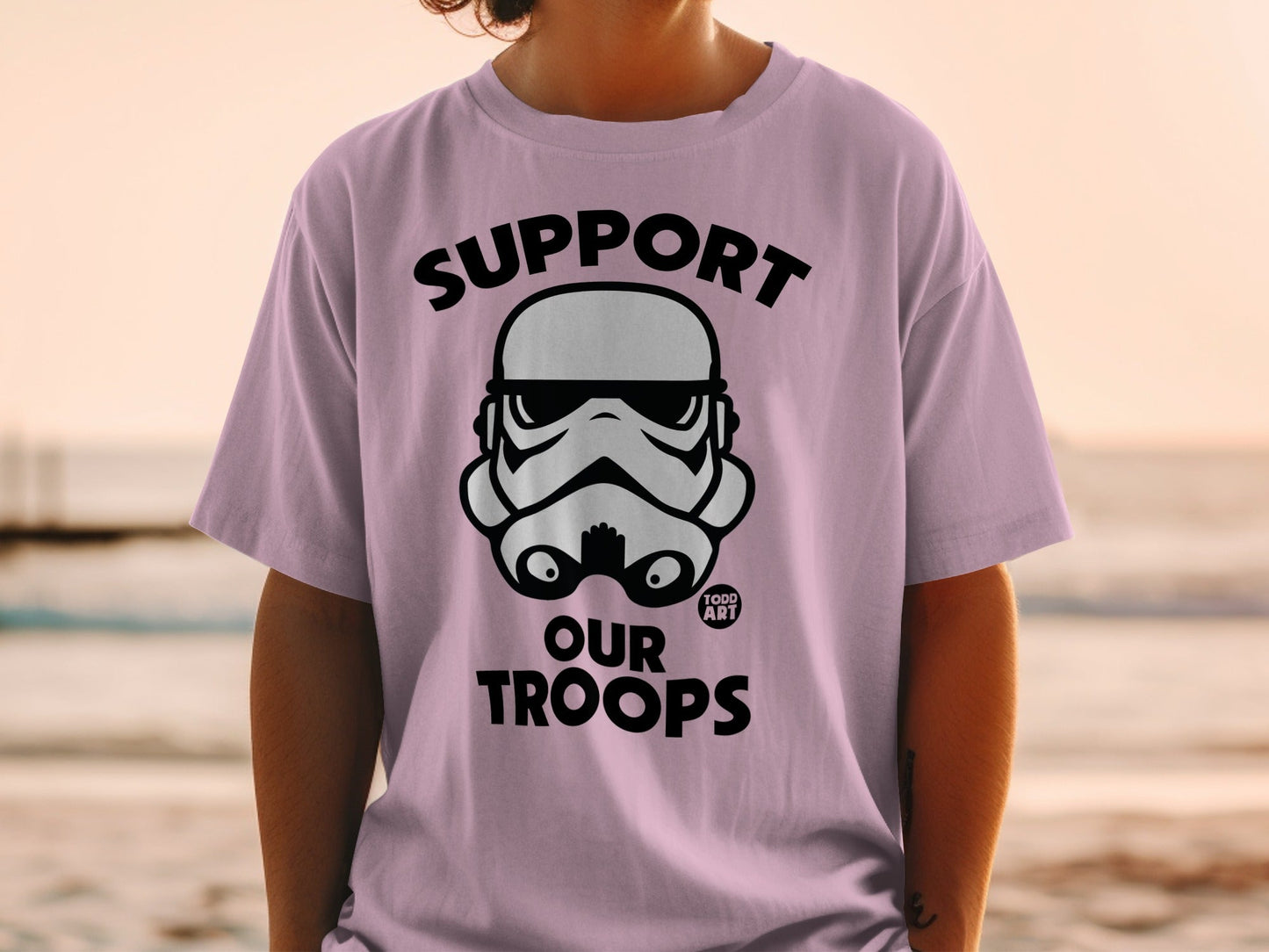 Purple t-shirt with a black stormtrooper helmet and "SUPPORT OUR TROOPS" text.