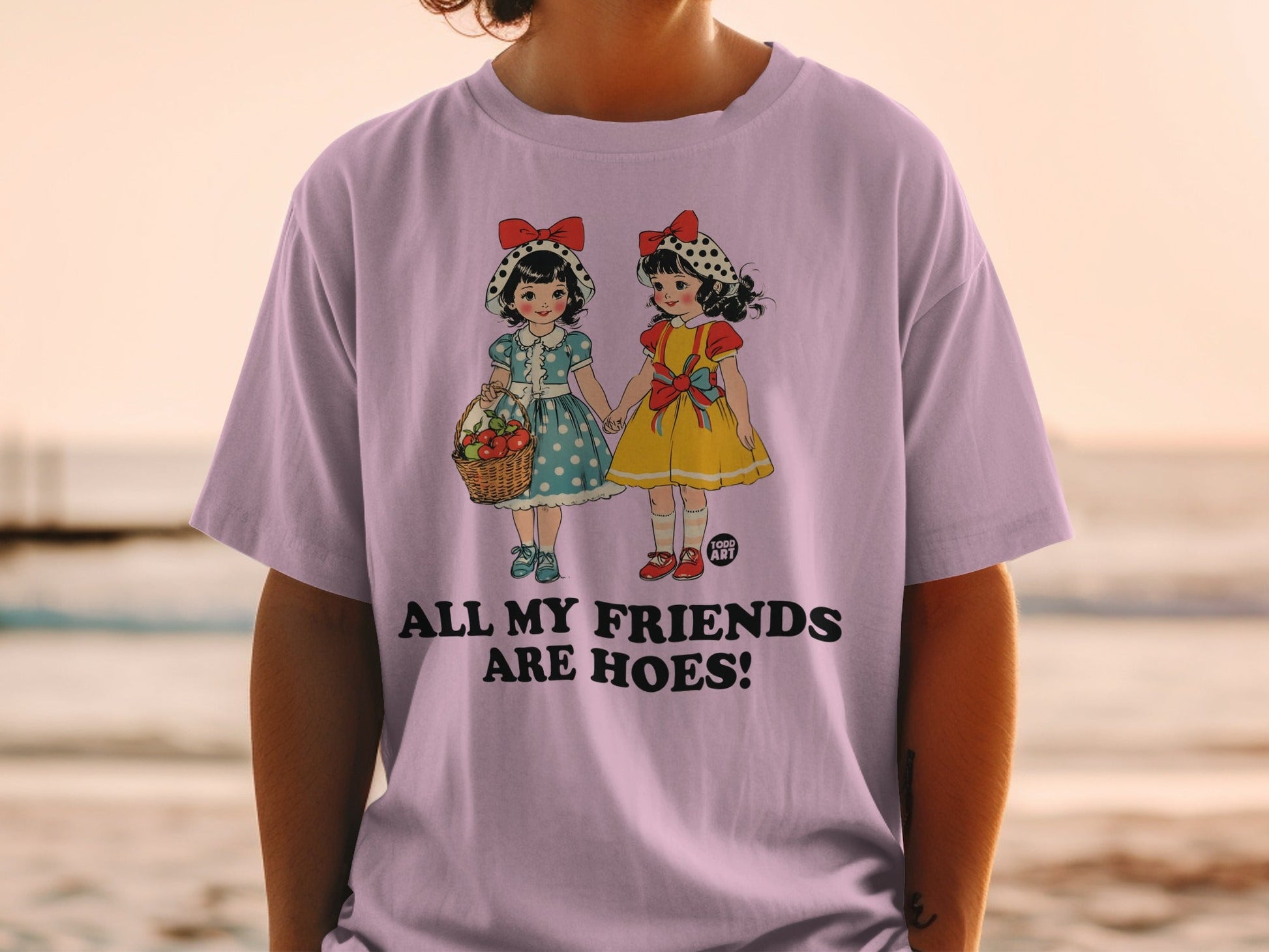 T-shirt graphic of two cartoon girls with a basket, text "ALL MY FRIENDS ARE HOES!".