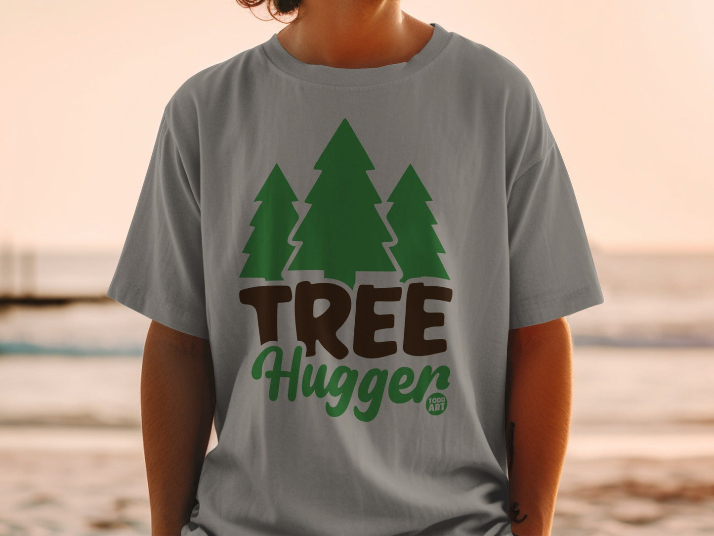 Grey t-shirt with green trees and "TREE Hugger" text.