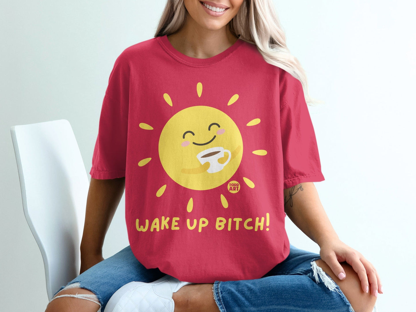 Red t-shirt with a smiling sun holding coffee and "WAKE UP BITCH!" text.
