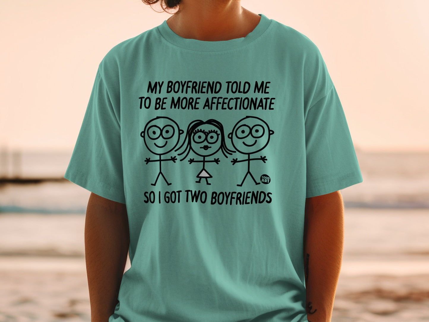 T-shirt with stick figures and text: "My boyfriend told me to be more affectionate so I got two boyfriends."