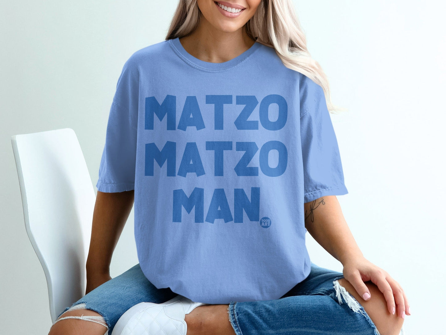 Light blue t-shirt with "MATZO MATZO MAN" and "TOO ART" text.