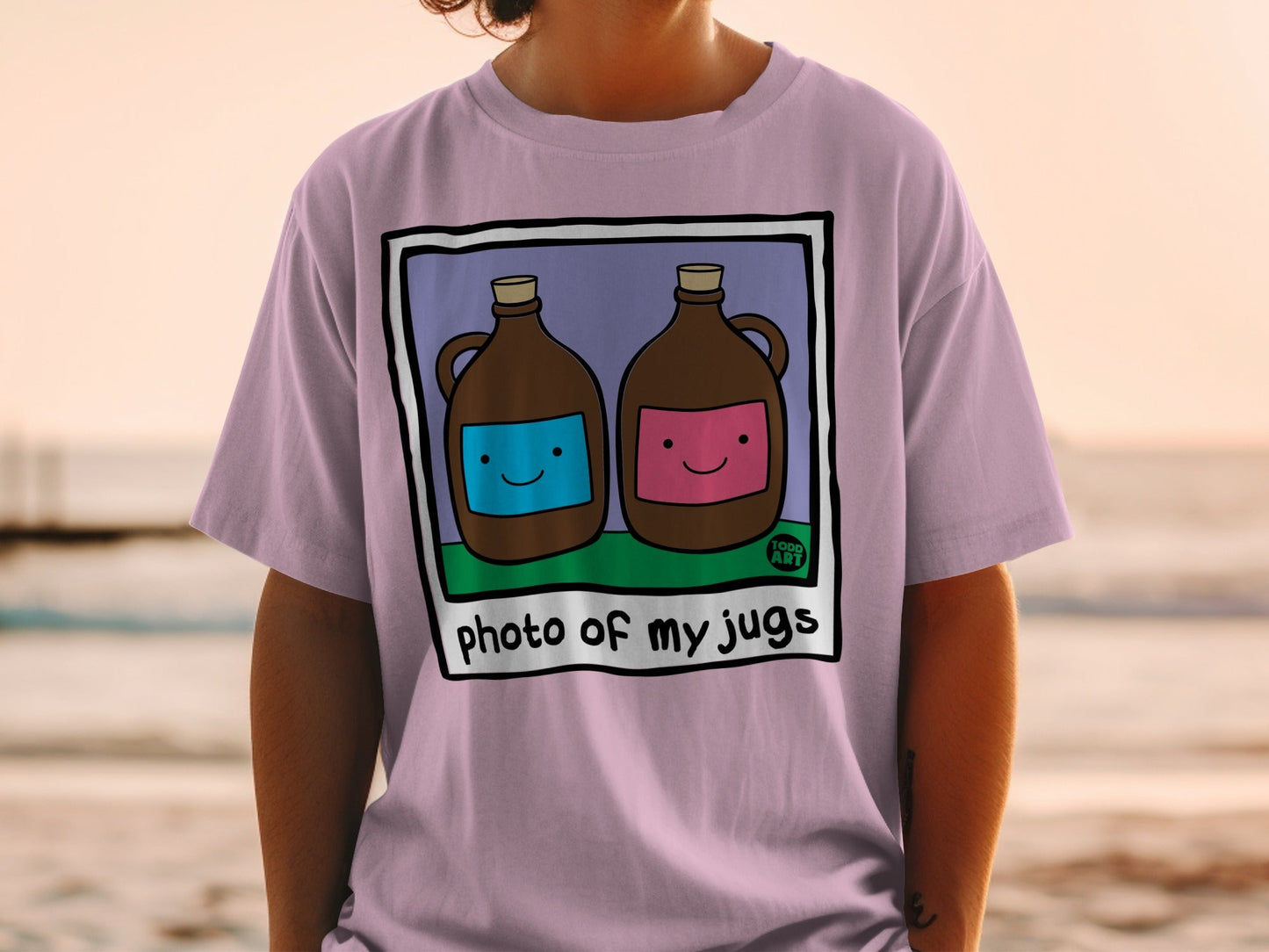 Two jugs with smiley faces on a t-shirt.