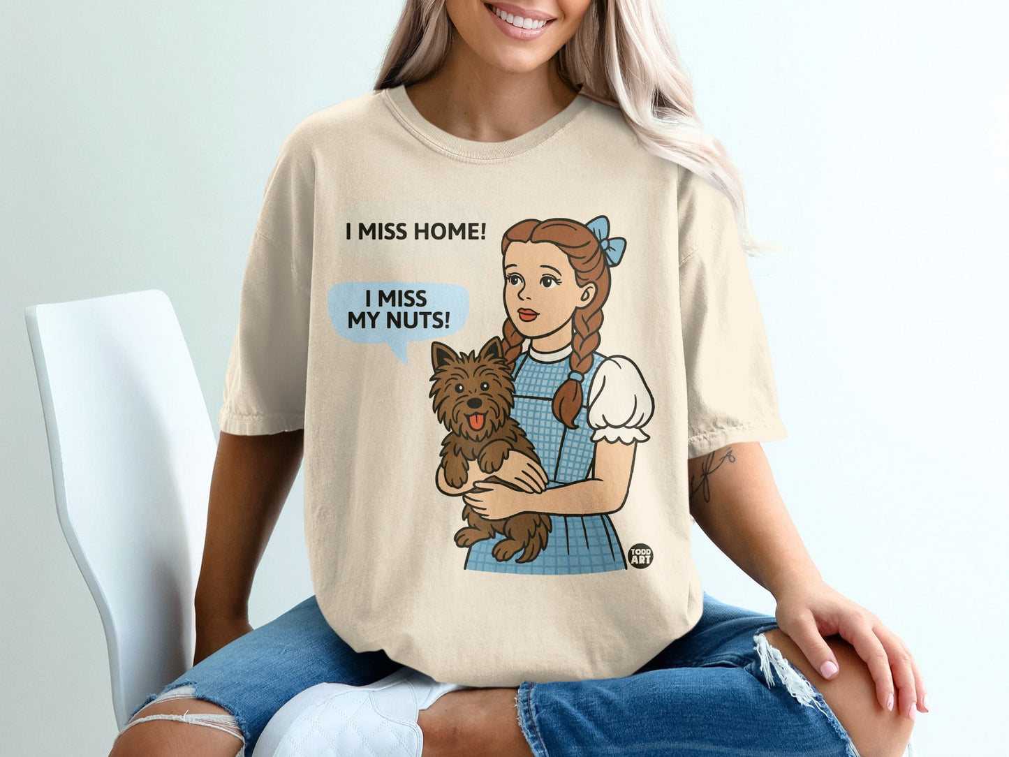 Dorothy from The Wizard of Oz holding Toto, with text "I miss my nuts!".