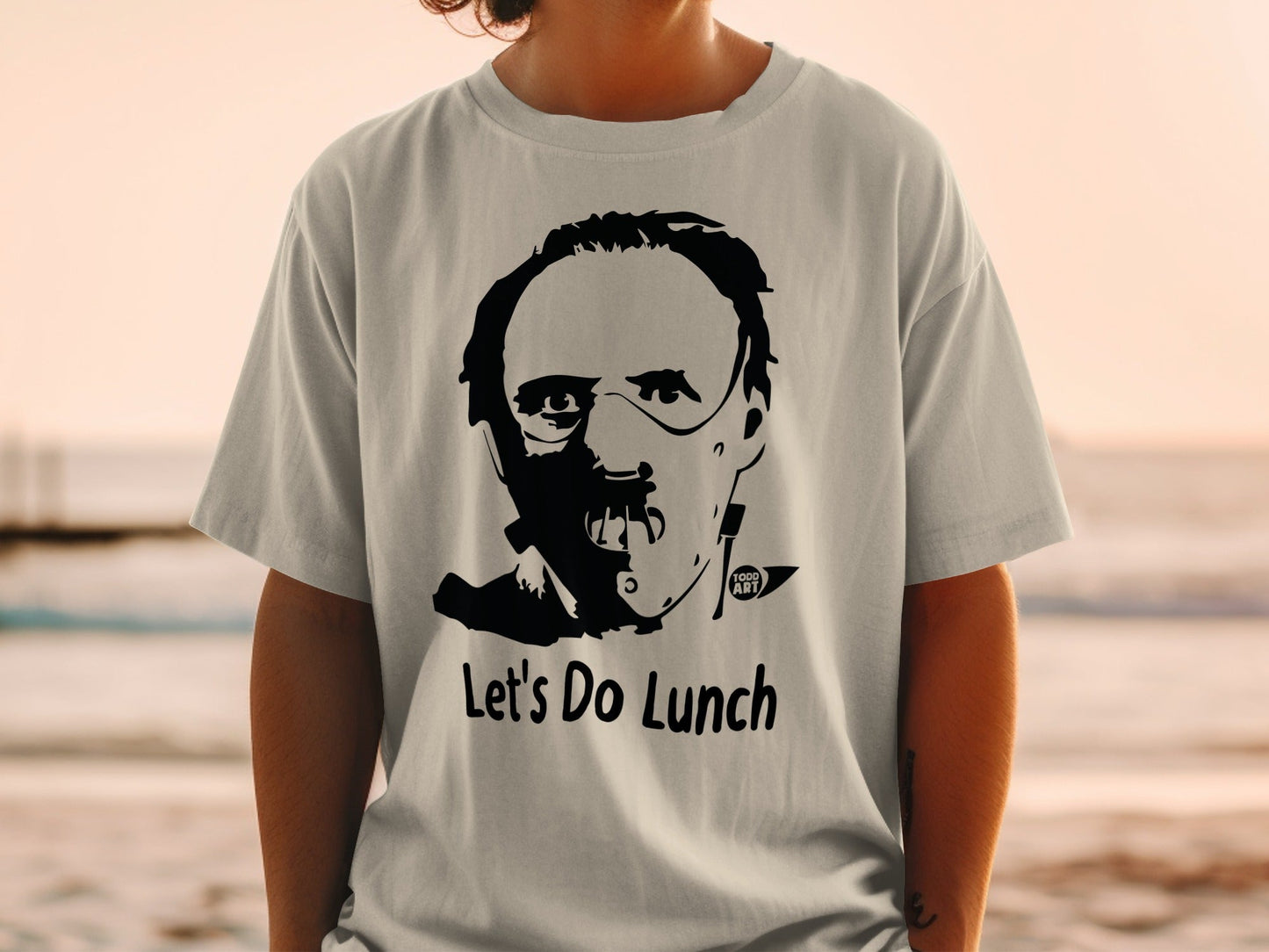T-shirt with Hannibal Lecter mask graphic and "Let's Do Lunch" text.