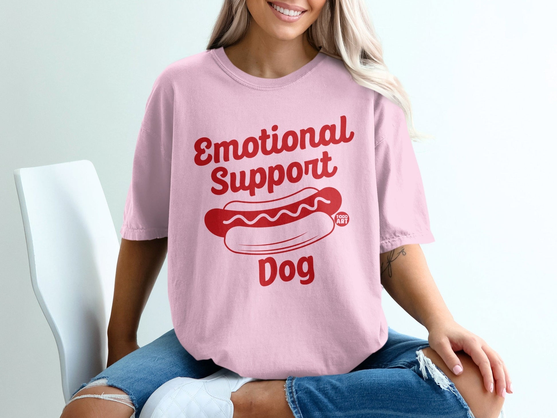 Pink t-shirt with "Emotional Support Dog" and a hot dog graphic.
