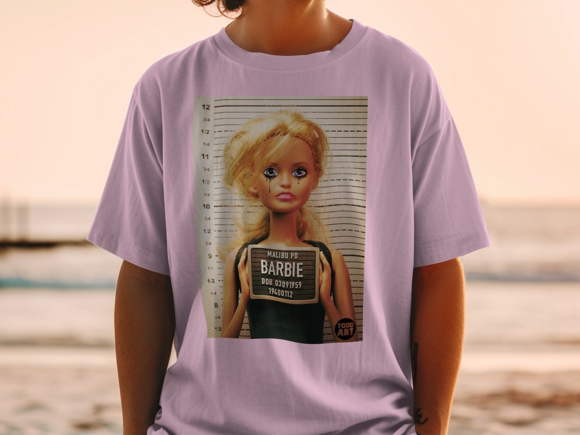 T-shirt with Barbie's Malibu PD mugshot, DOB 03091959.
