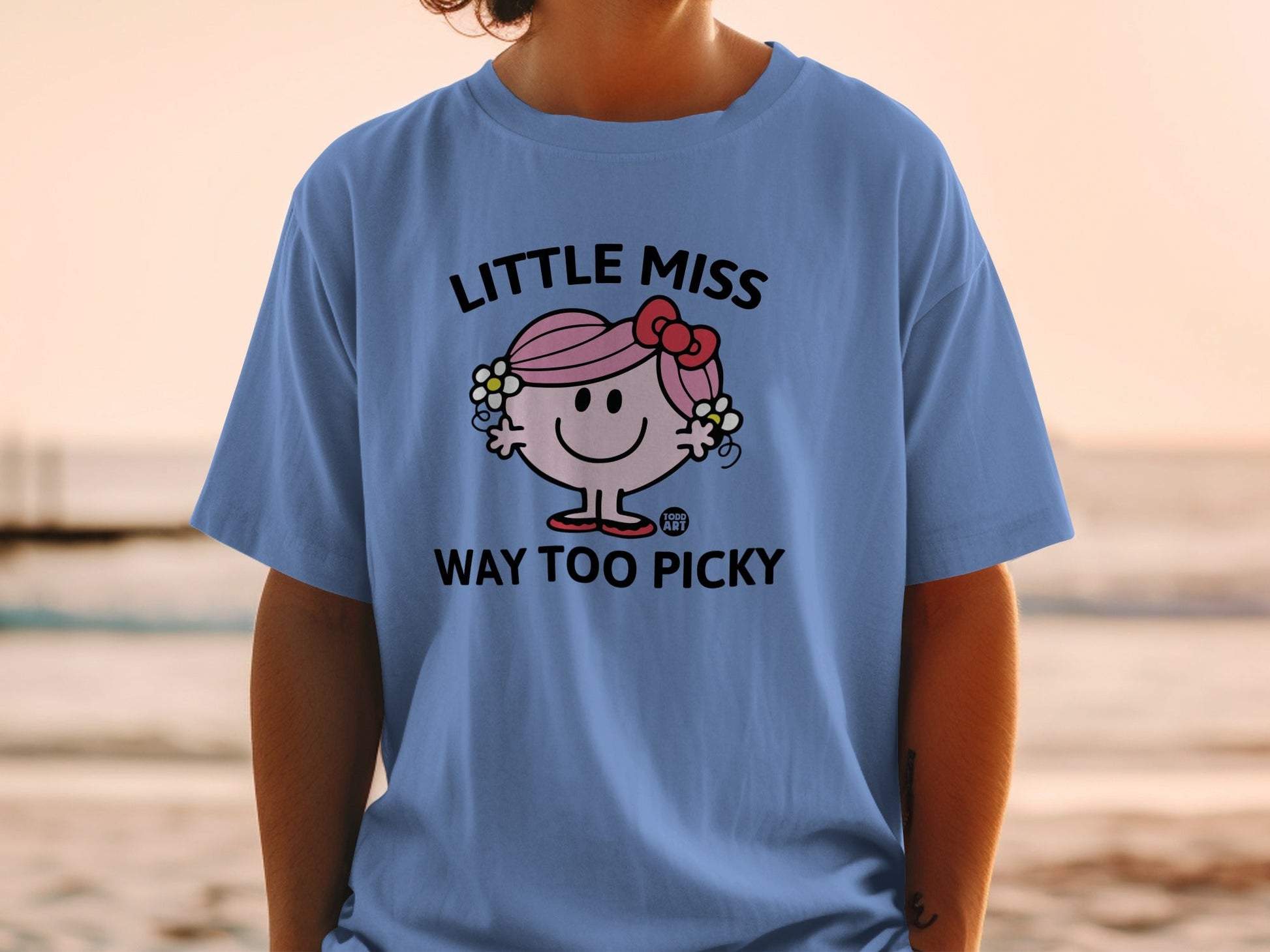 Blue t-shirt with "Little Miss Way Too Picky" text and cartoon character.