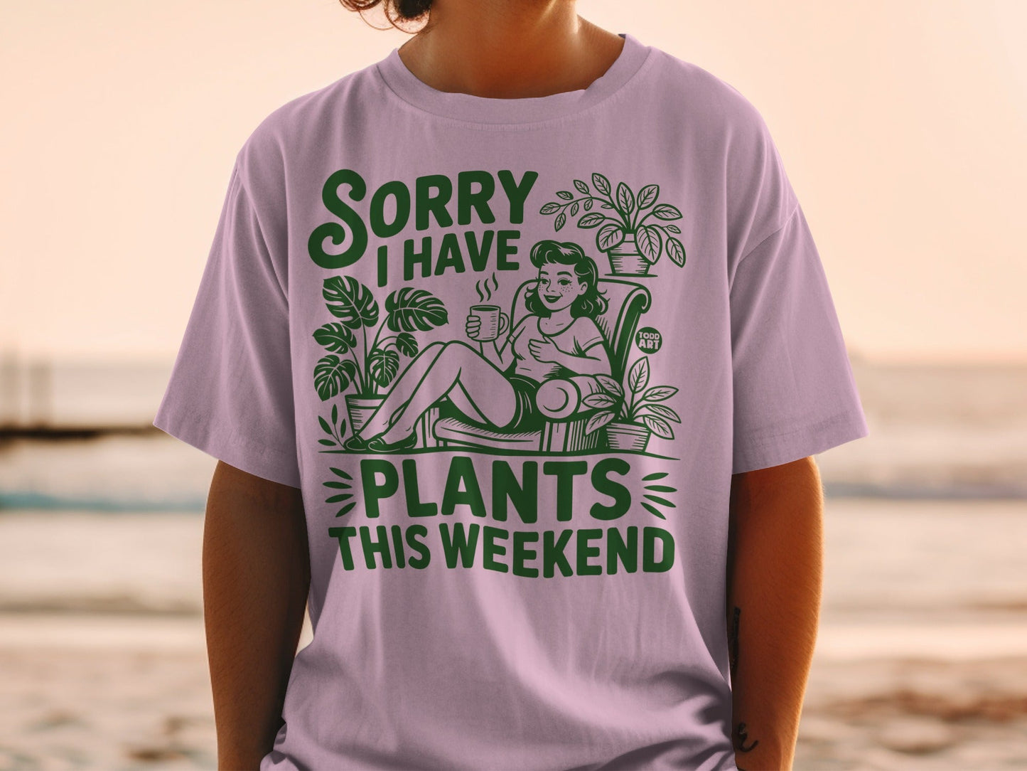 Green t-shirt with "Sorry I have plants this weekend" text and woman tending plants.