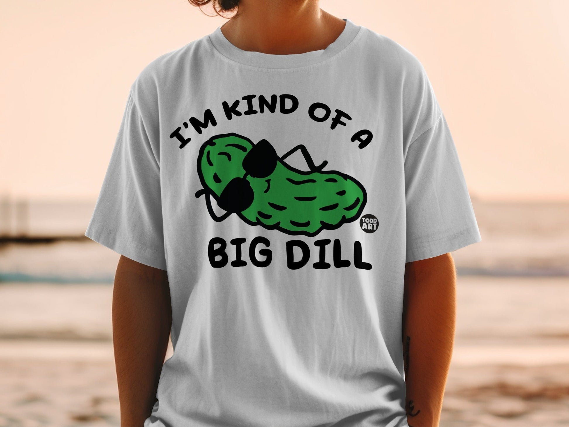 T-shirt with a pickle wearing sunglasses and text "I'M KIND OF A BIG DILL".