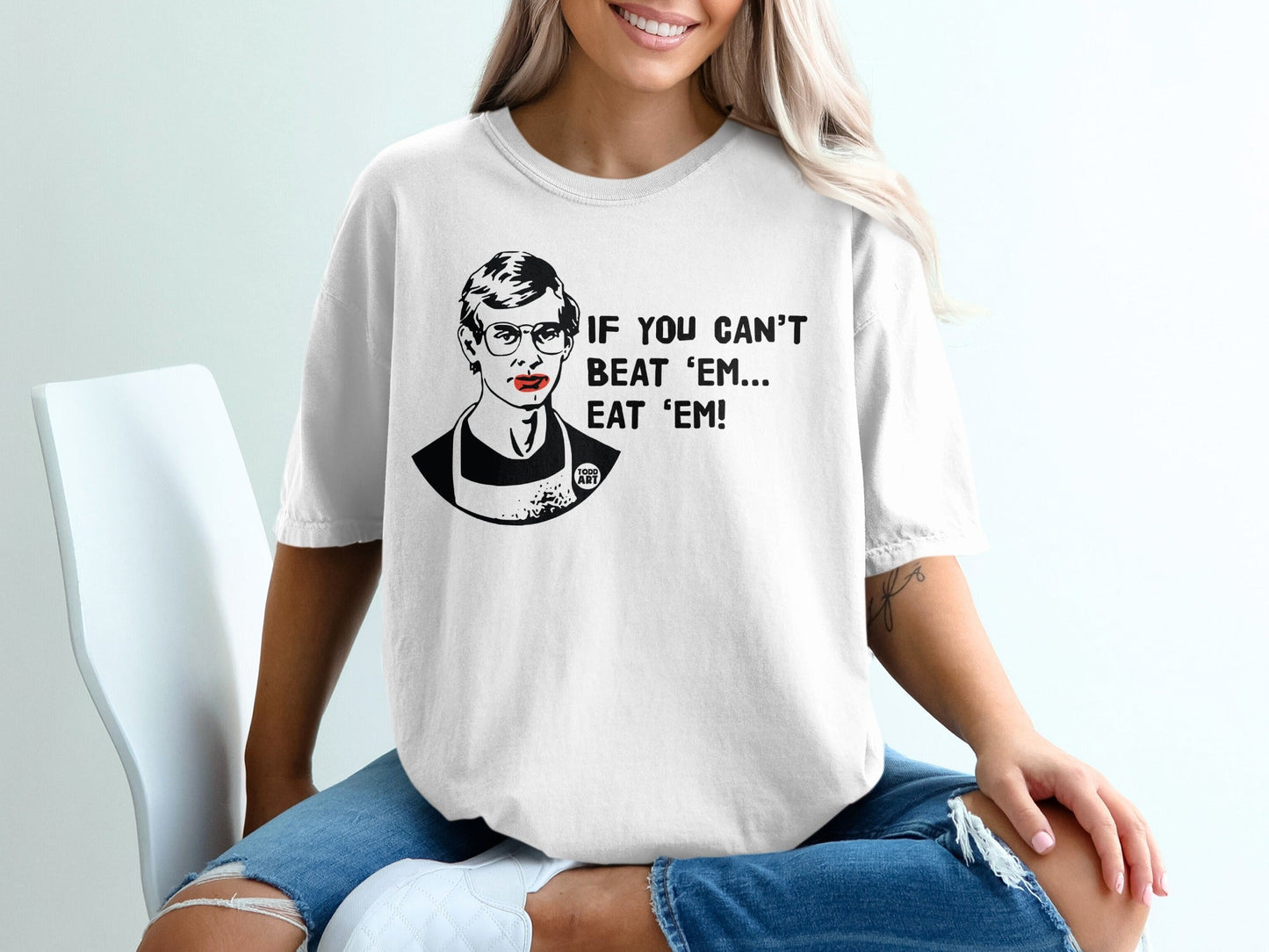 Ruth Bader Ginsburg graphic on a white t-shirt, "IF YOU CAN'T BEAT 'EM... EAT 'EM!"