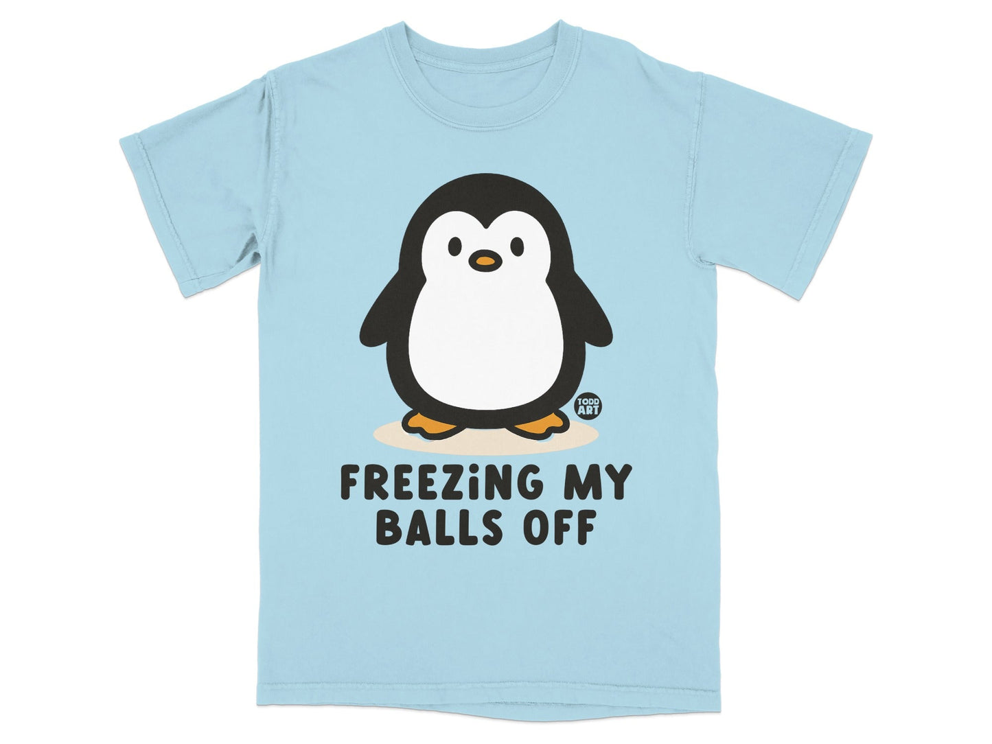 Light blue t-shirt with cartoon penguin and text "FREEZING MY BALLS OFF".