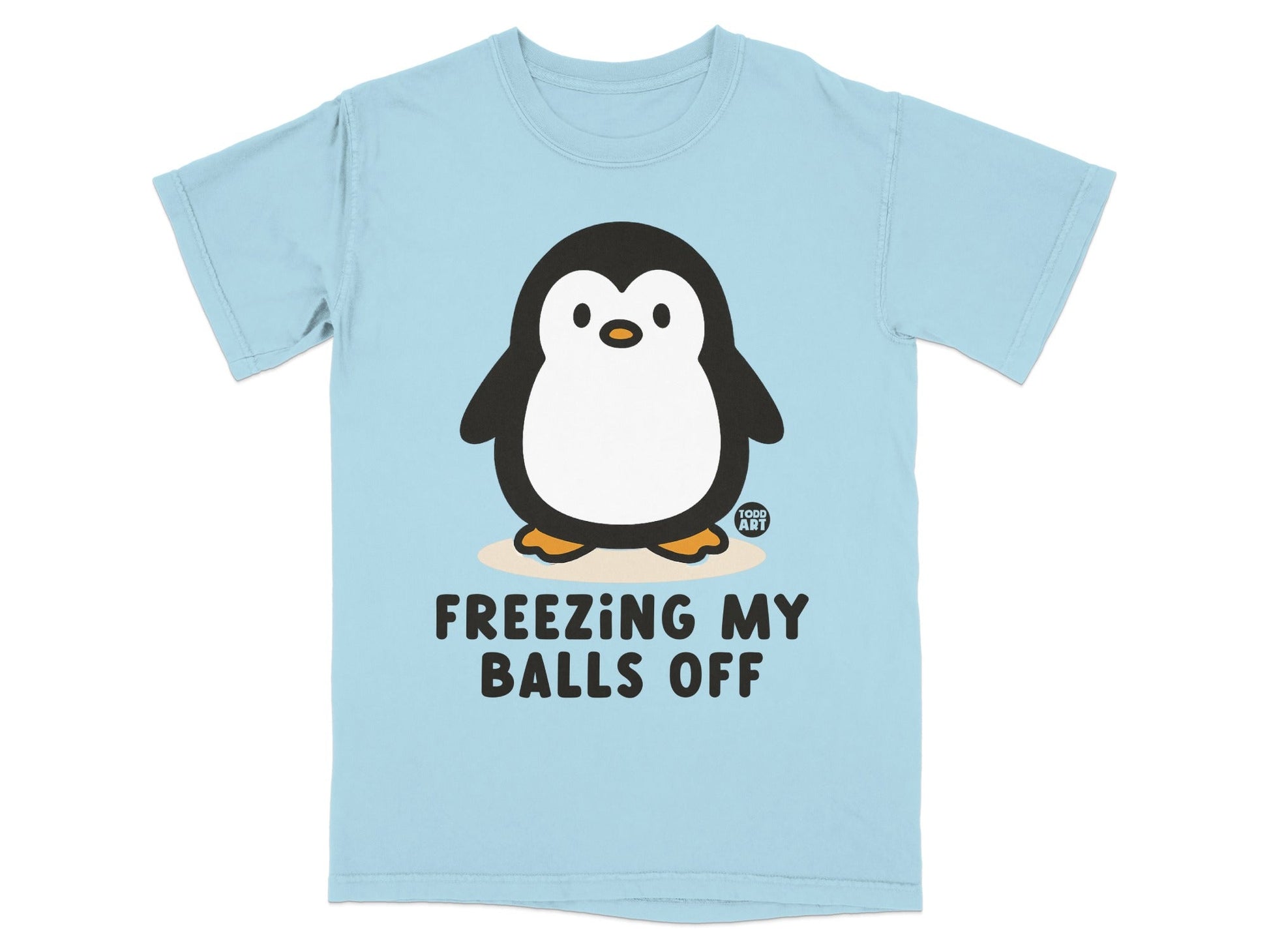 Light blue t-shirt with cartoon penguin and text "FREEZING MY BALLS OFF".