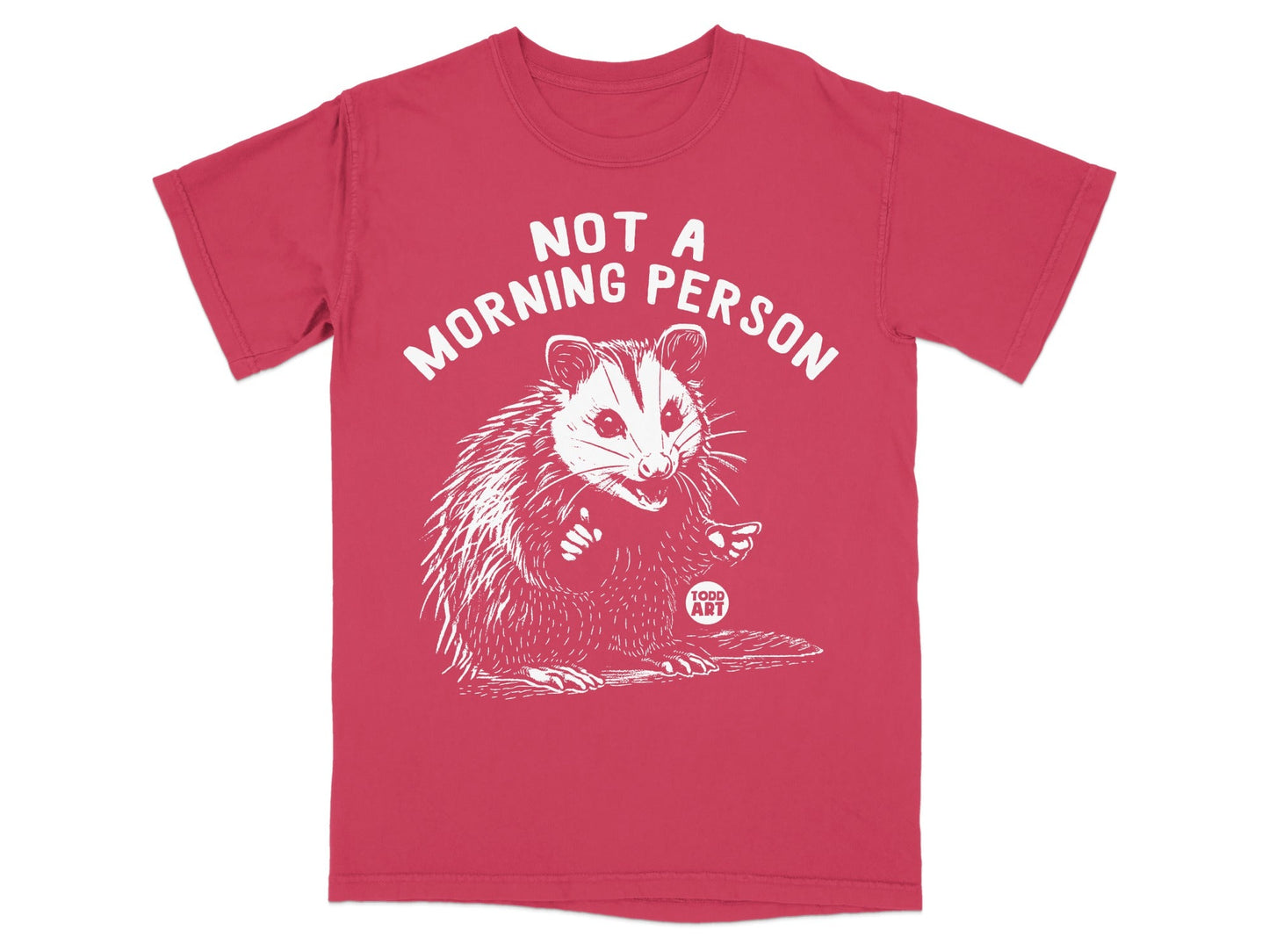 Red t-shirt with a white drawing of an opossum giving a thumbs-up, and text reading "NOT A MORNING PERSON".