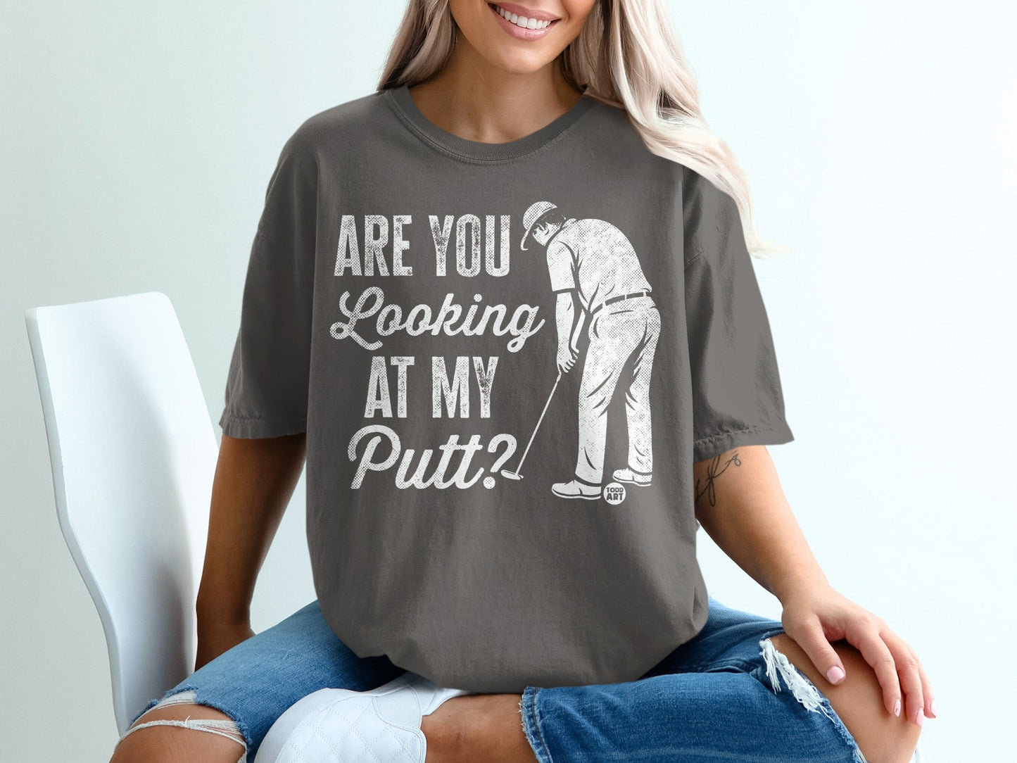 T-shirt with "Are You Looking At My Putt?" golf graphic.