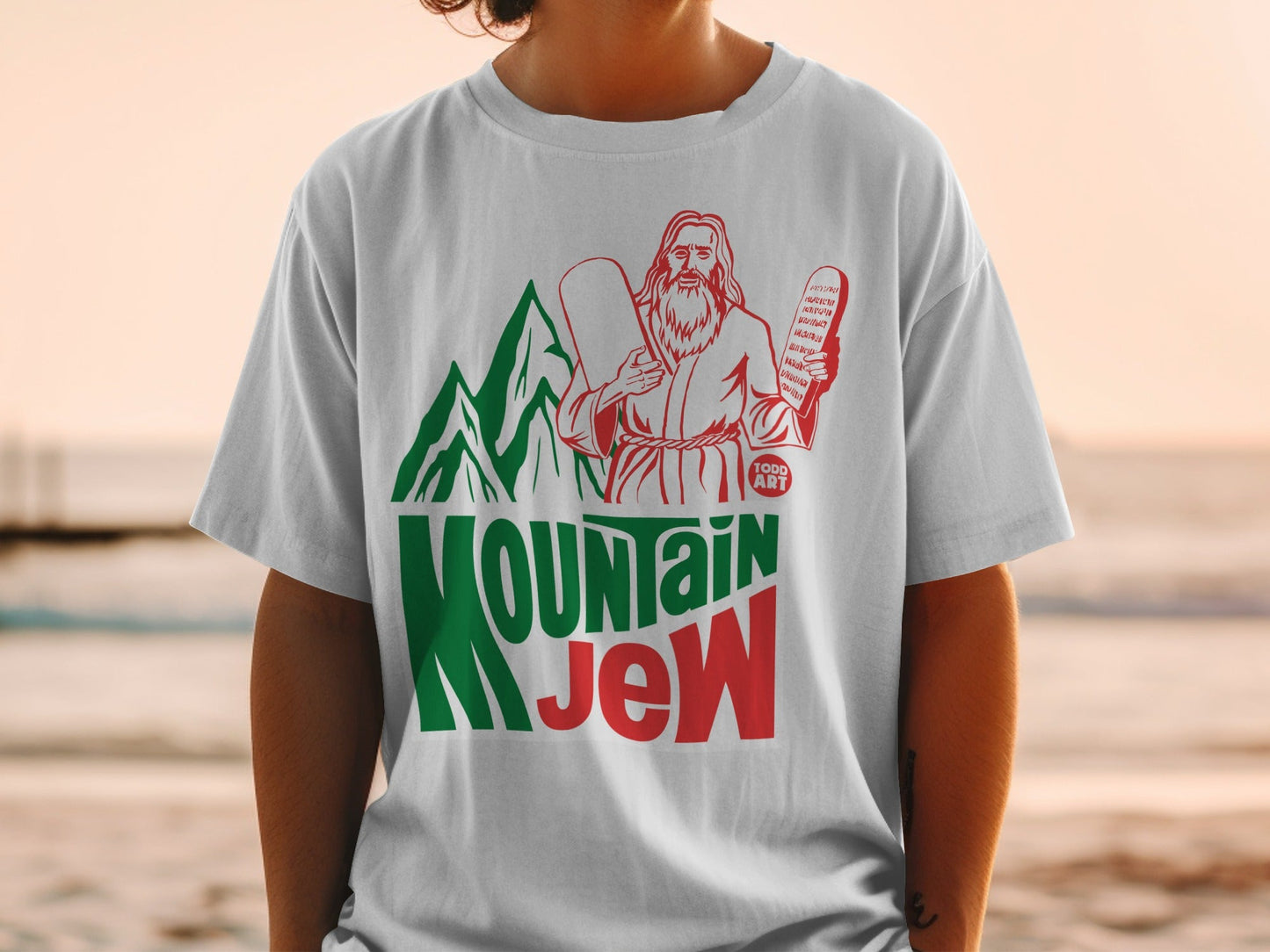 T-shirt with "Mountain Jew" text, a bearded figure holding tablets.