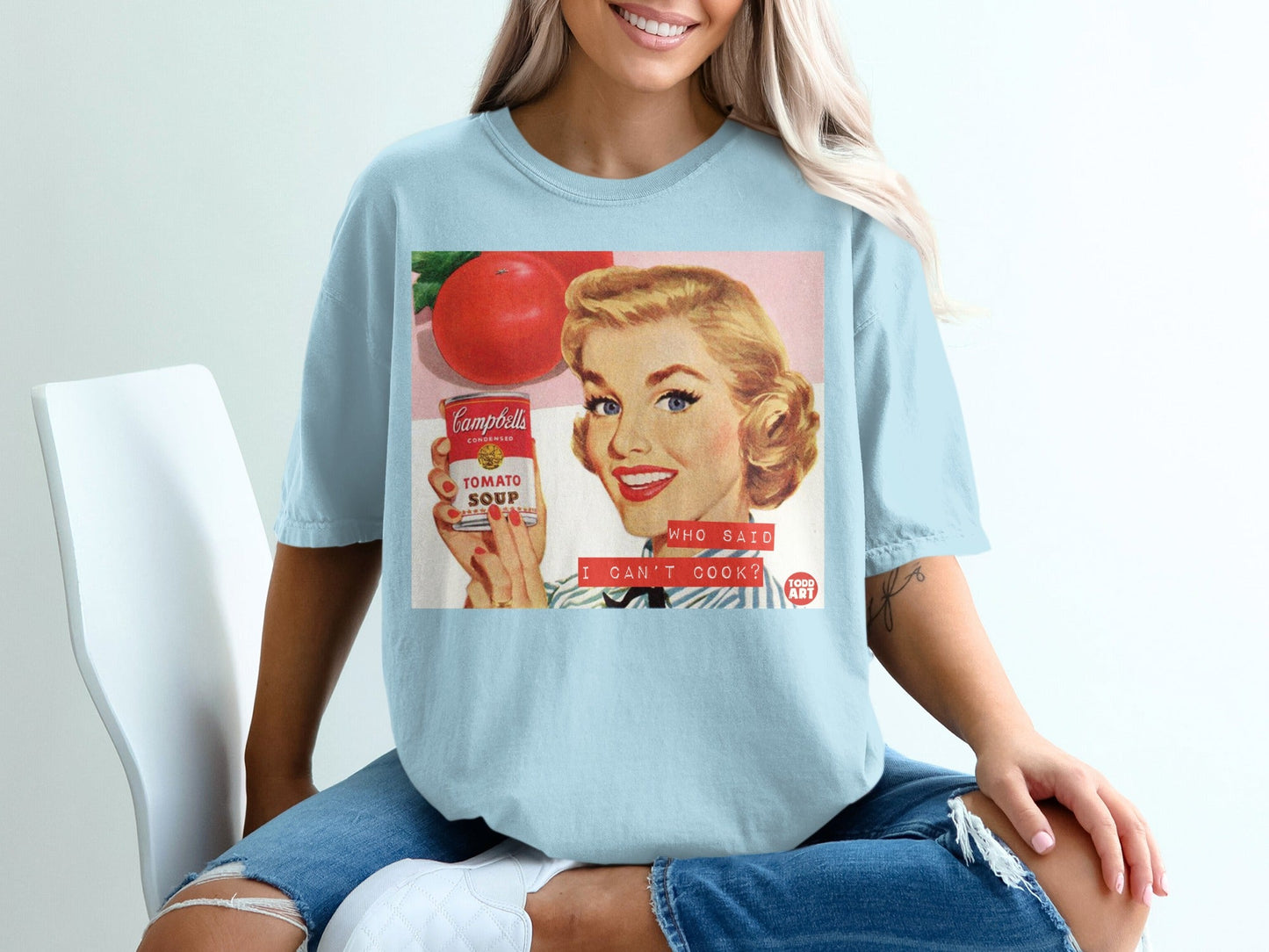 Vintage Campbell's soup ad with woman holding can and text "WHO SAID I CAN'T COOK?"
