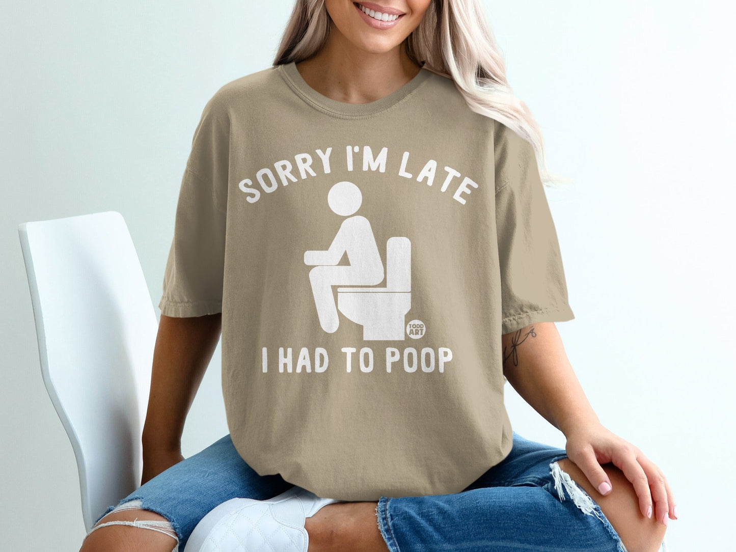 T-shirt with text "SORRY I'M LATE I HAD TO POOP" and toilet graphic.