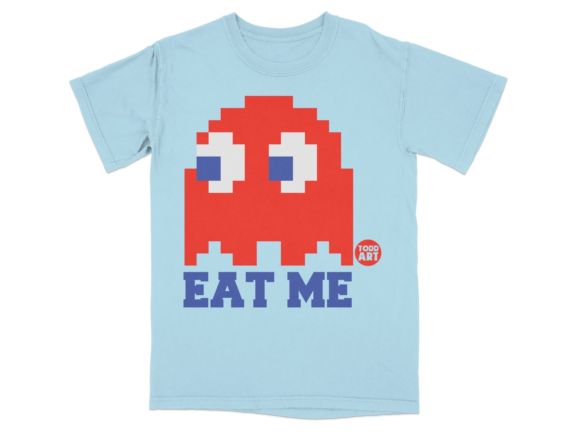 Light blue t-shirt with red Pac-Man ghost graphic and "EAT ME" text.