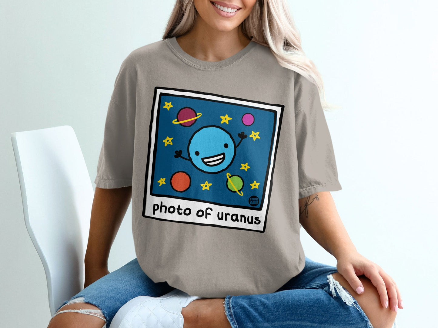 Cartoon planets and stars in a square frame with "photo of uranus" text.