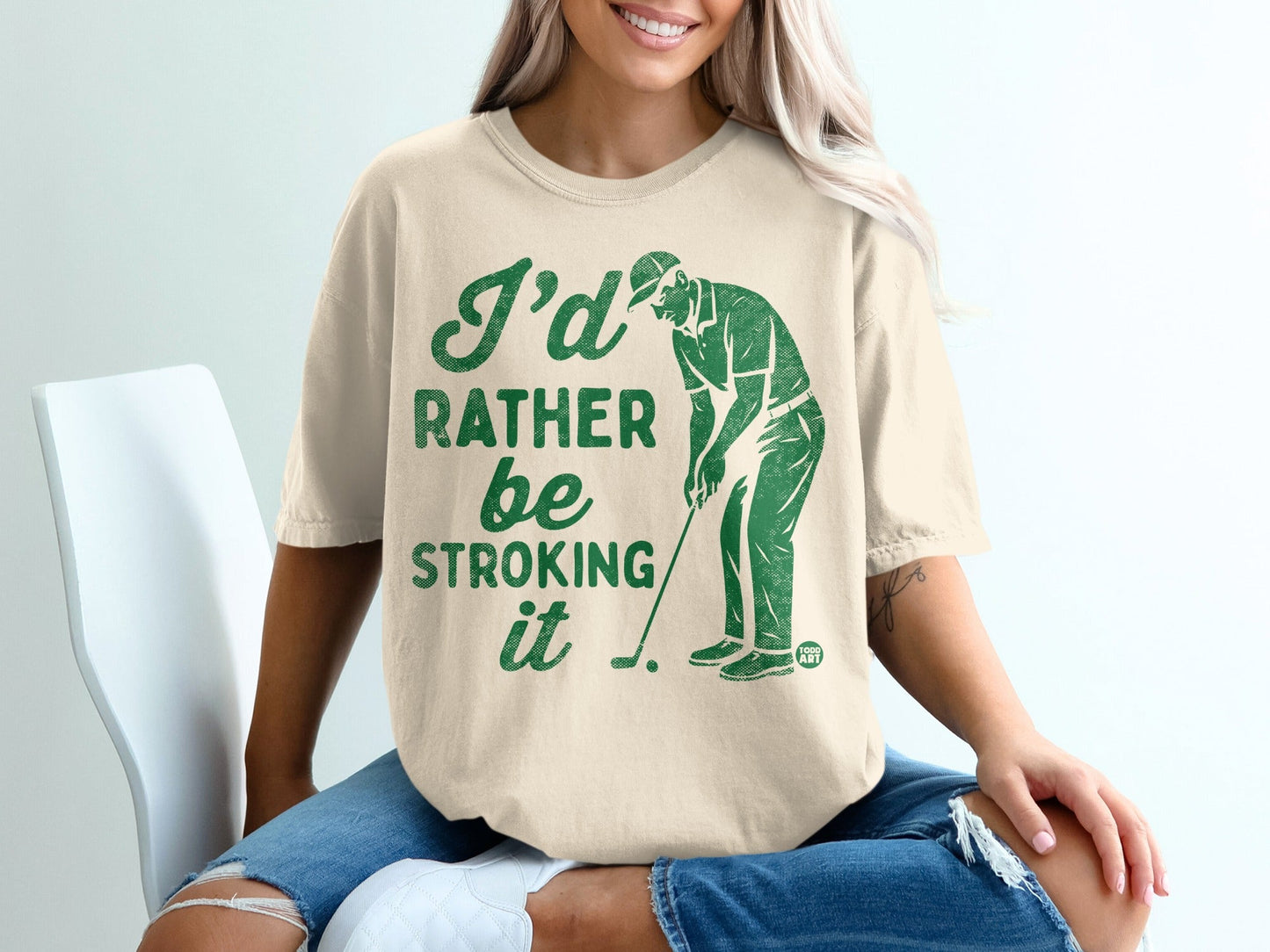 T-shirt with golfer graphic and "I'd rather be stroking it" text.