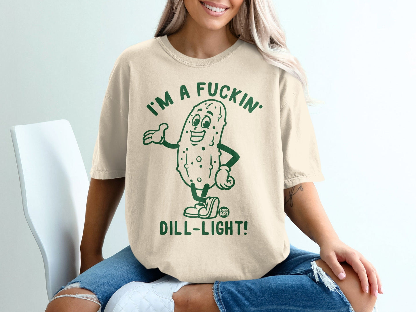 T-shirt with cartoon dill pickle saying "I'm a fuckin' dill-light!"