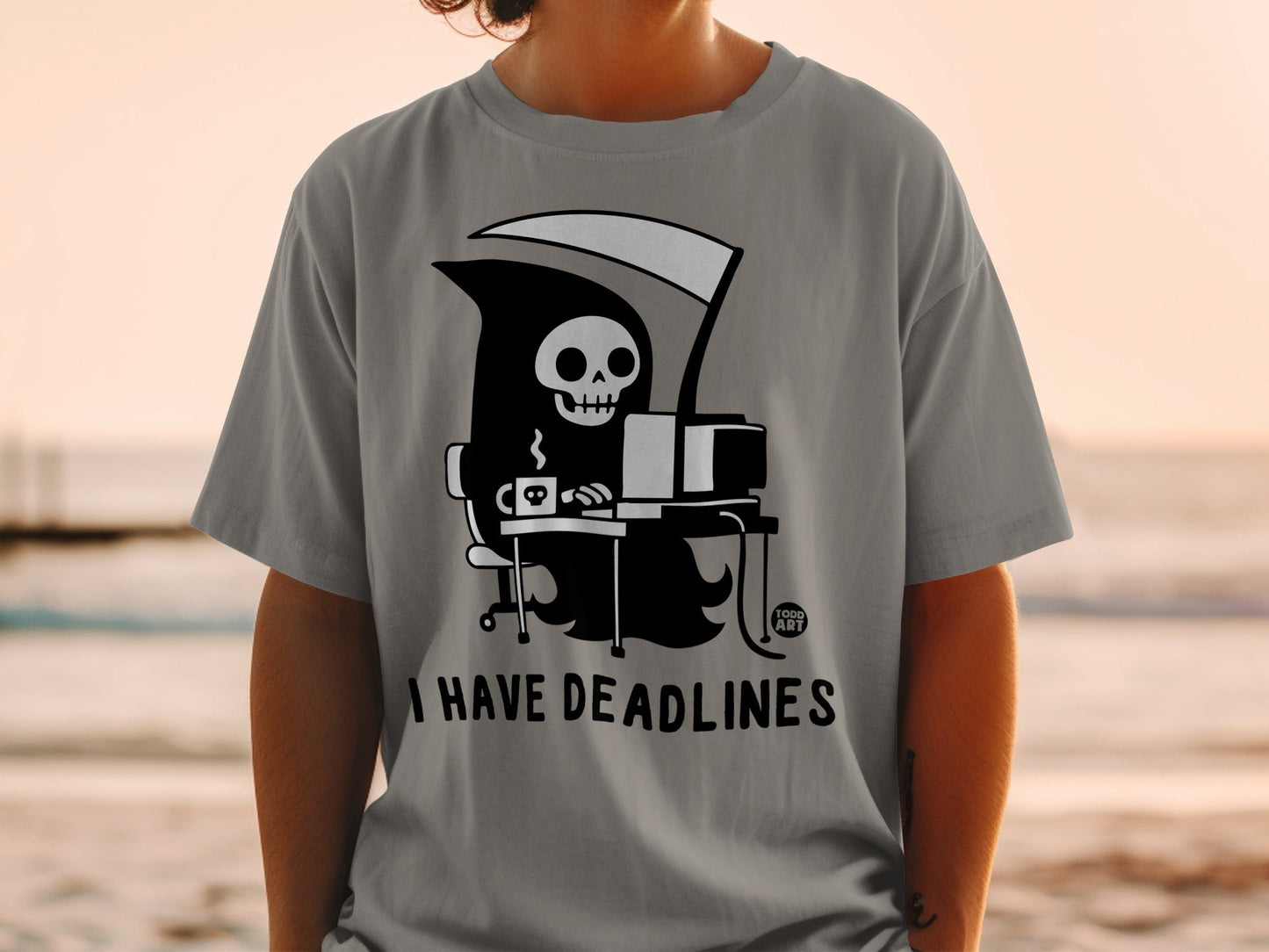 Grim reaper at a computer with coffee, text "I HAVE DEADLINES".
