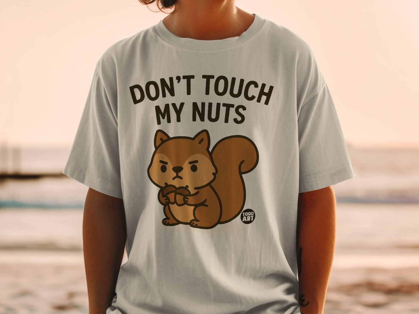 T-shirt with cartoon squirrel and text "DON'T TOUCH MY NUTS".