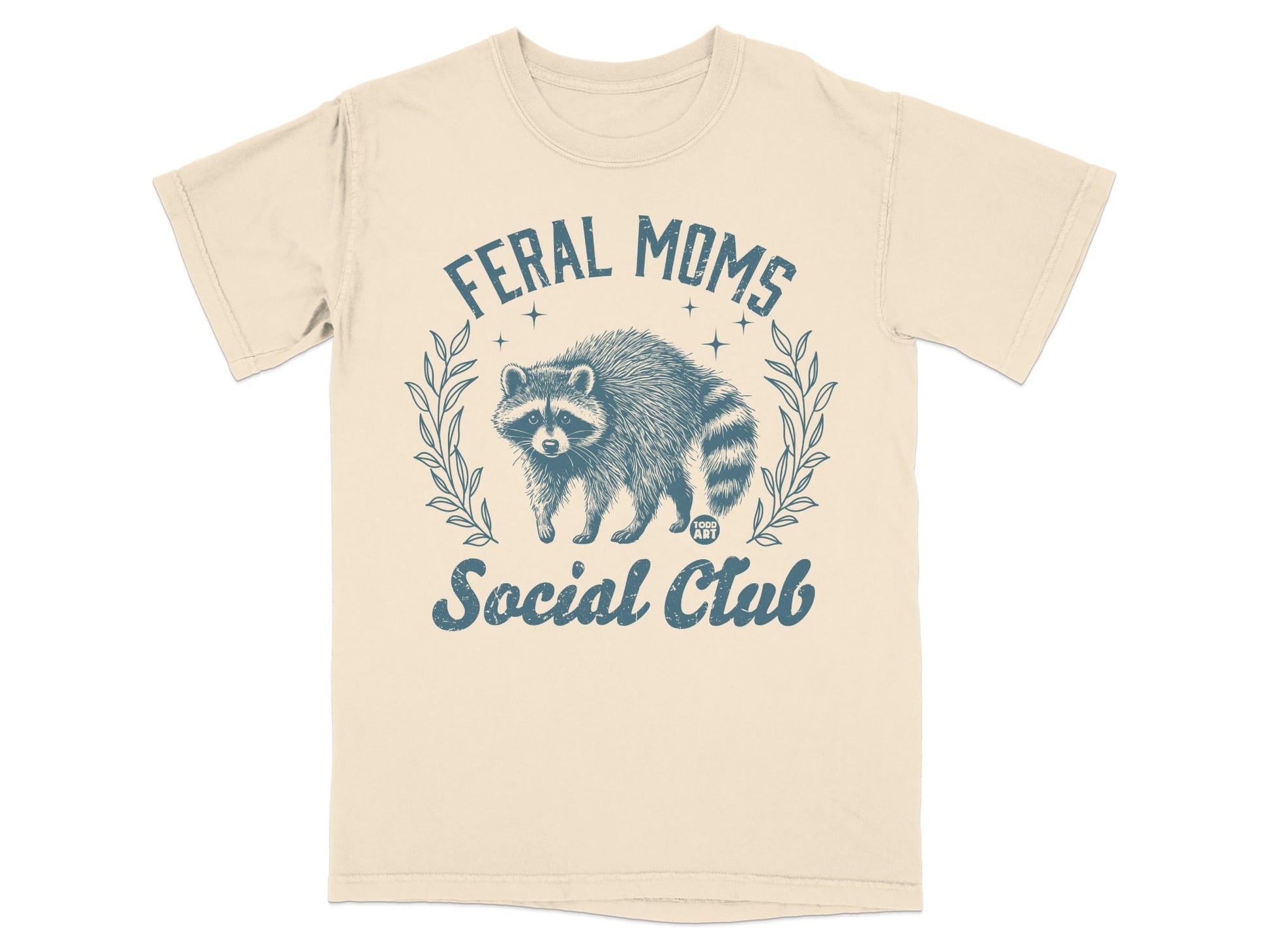 T-shirt featuring a raccoon with "FERAL MOMS SOCIAL CLUB" text.