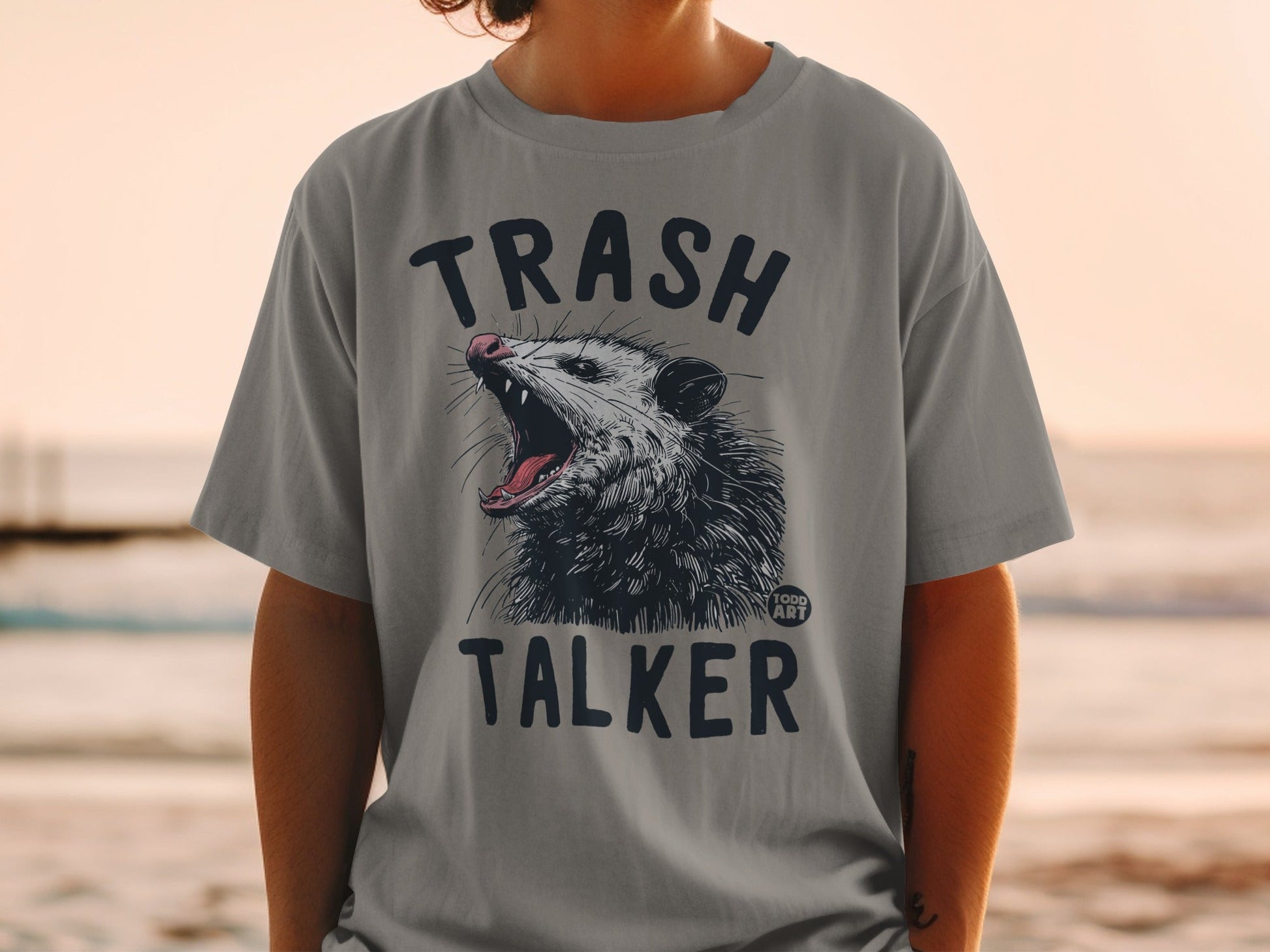 Gray t-shirt with "TRASH TALKER" and a possum illustration.