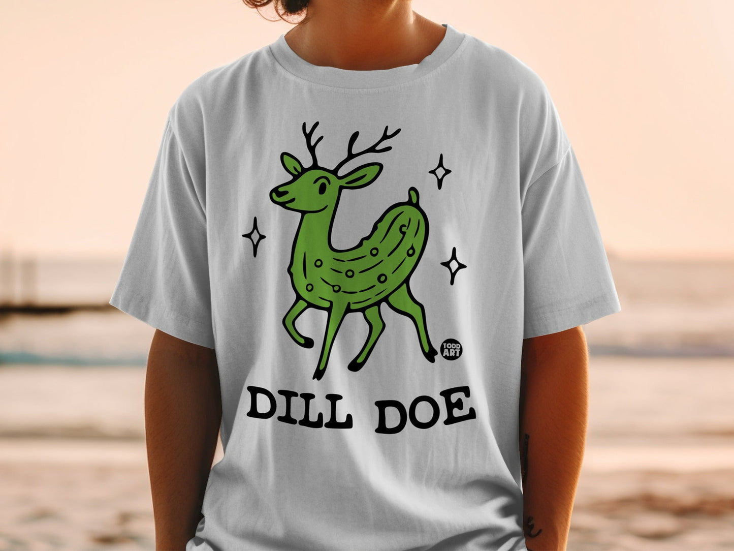Green cartoon deer with pickle texture, text reads "DILL DOE".