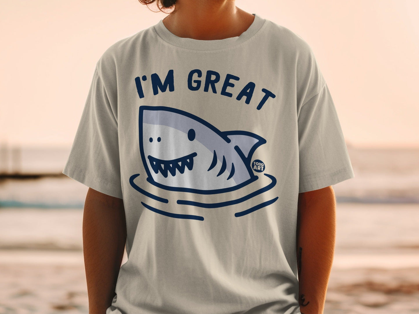 T-shirt with a cartoon shark emerging from water, text "I'M GREAT".