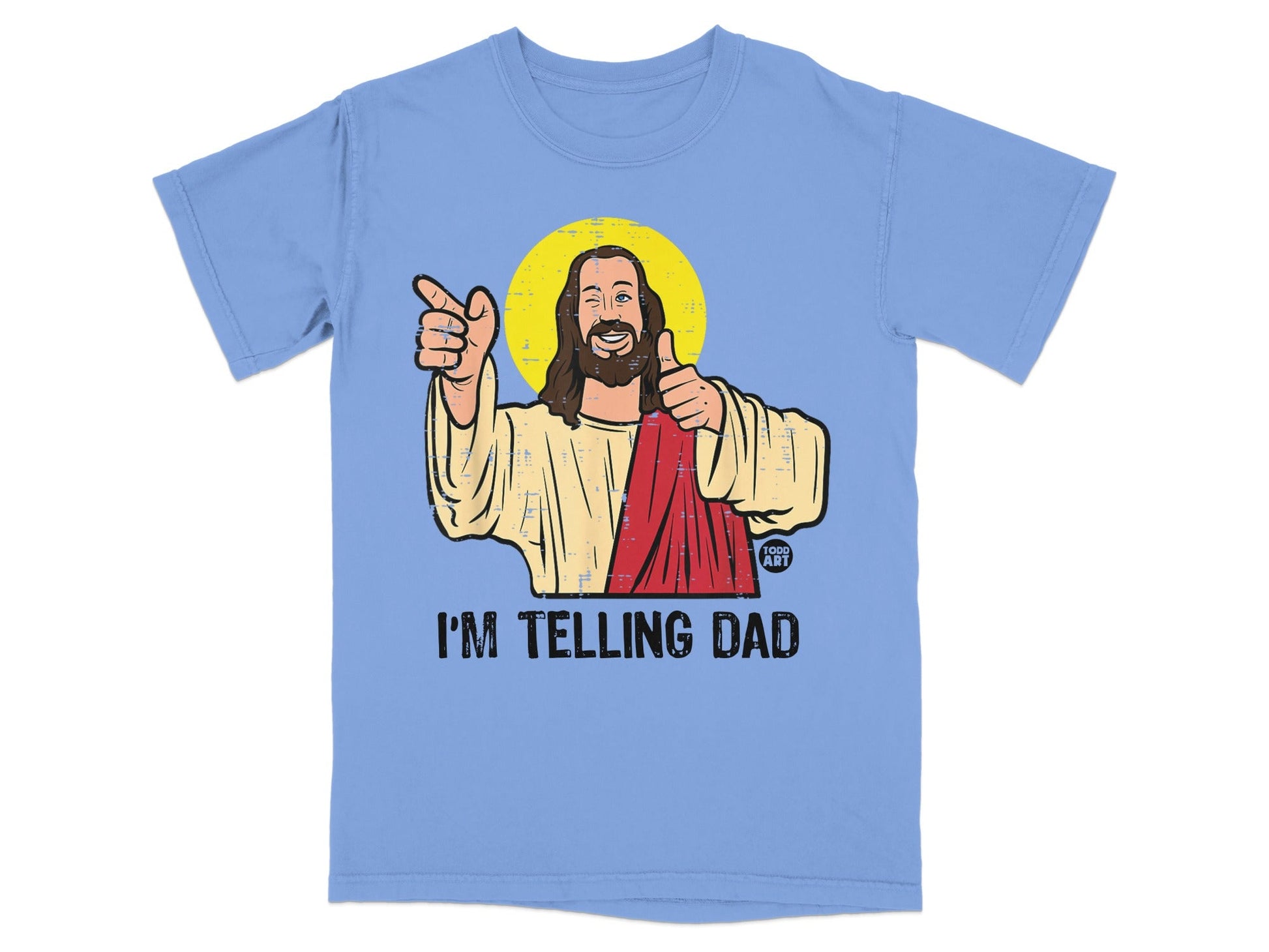 Light blue t-shirt with Jesus giving thumbs up and pointing, text reads "I'M TELLING DAD".
