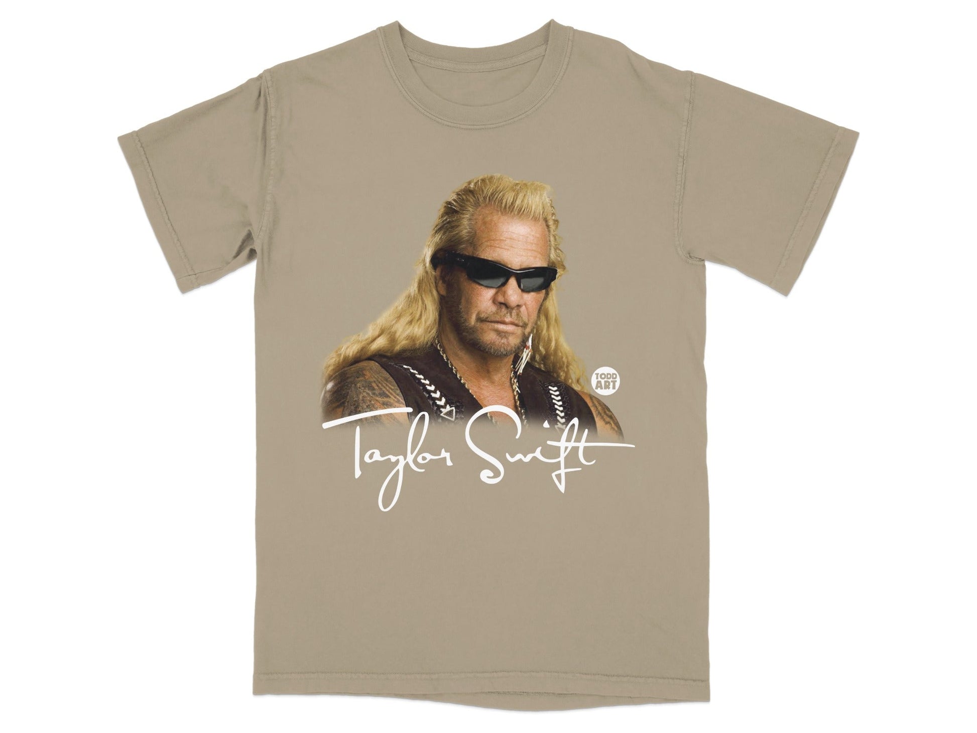 Tan t-shirt with graphic of Dog the Bounty Hunter and "Taylor Swift" text.