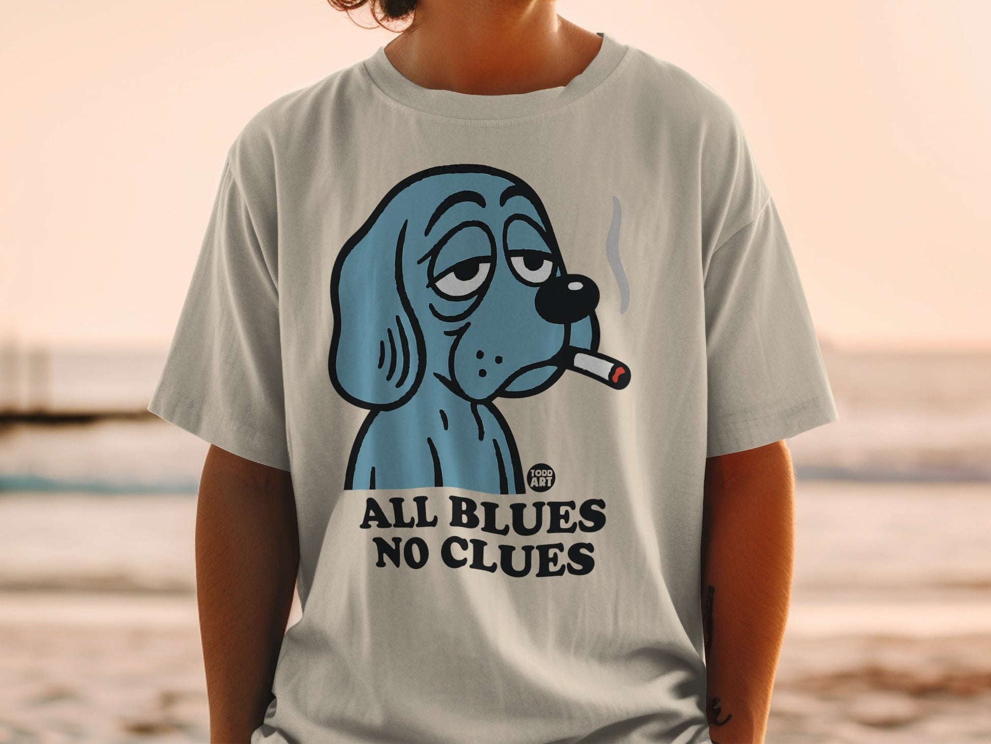 Blue dog wearing a collar, smoking a cigarette, with text "ALL BLUES NO CLUES".