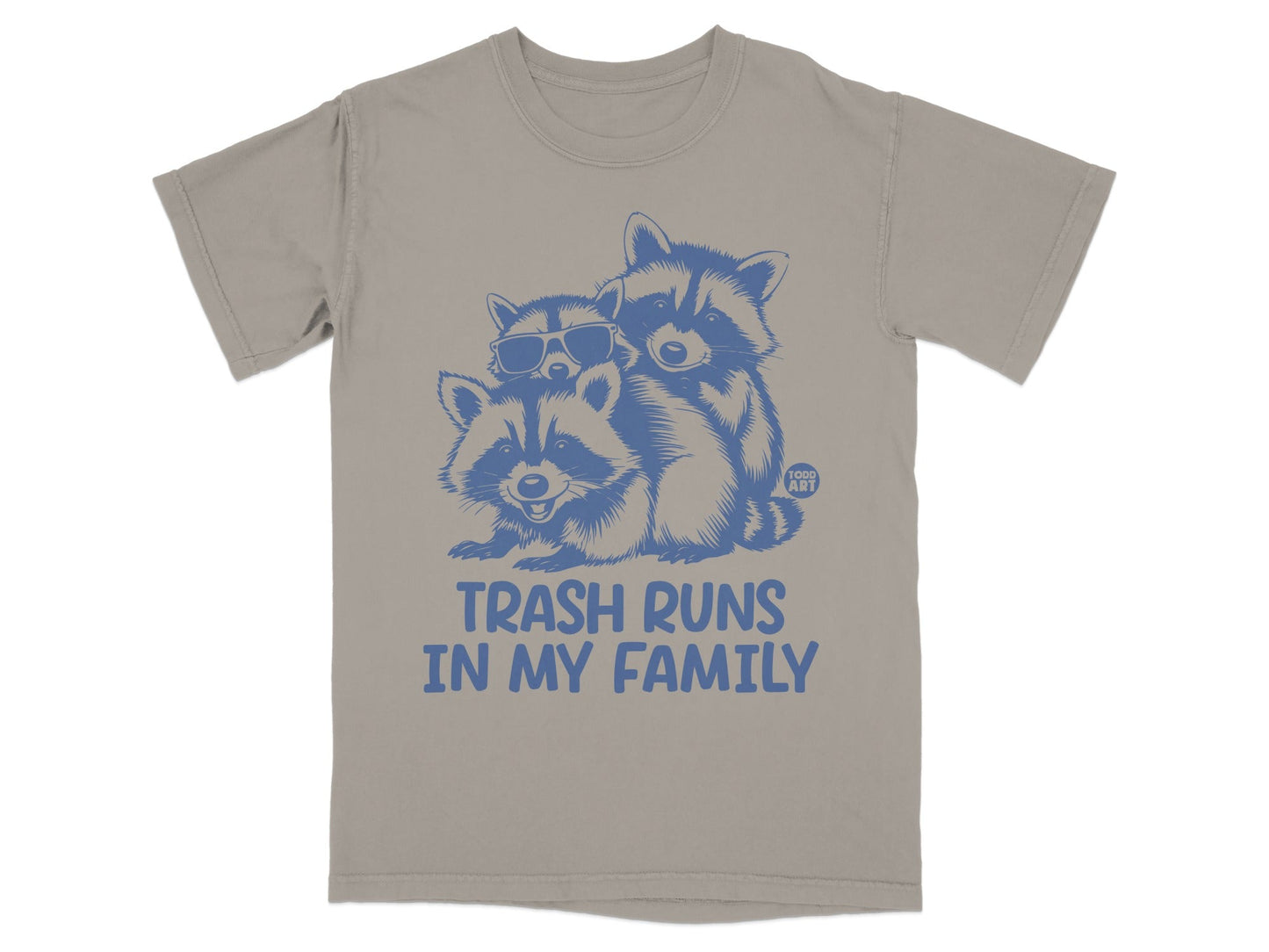 T-shirt graphic with three raccoons and text "Trash Runs In My Family".