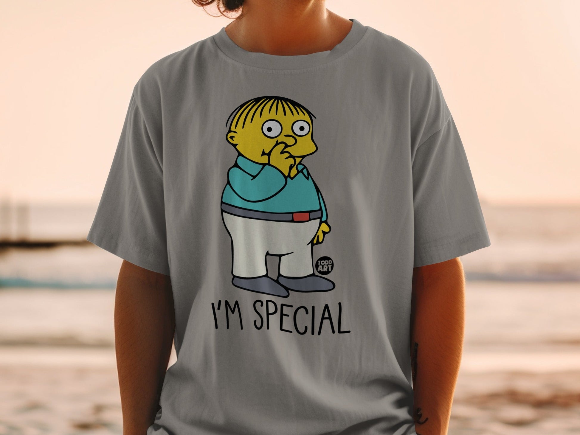 Ralph Wiggum from The Simpsons on a gray t-shirt with "I'M SPECIAL" text.