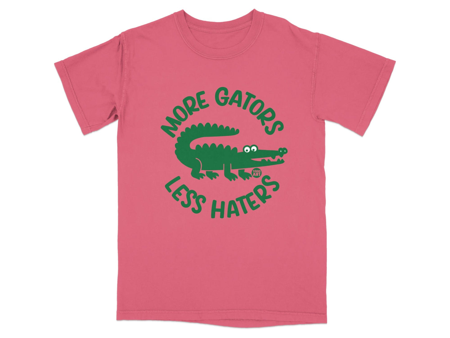 Pink t-shirt with green alligator graphic and text "MORE GATORS LESS HATERS".