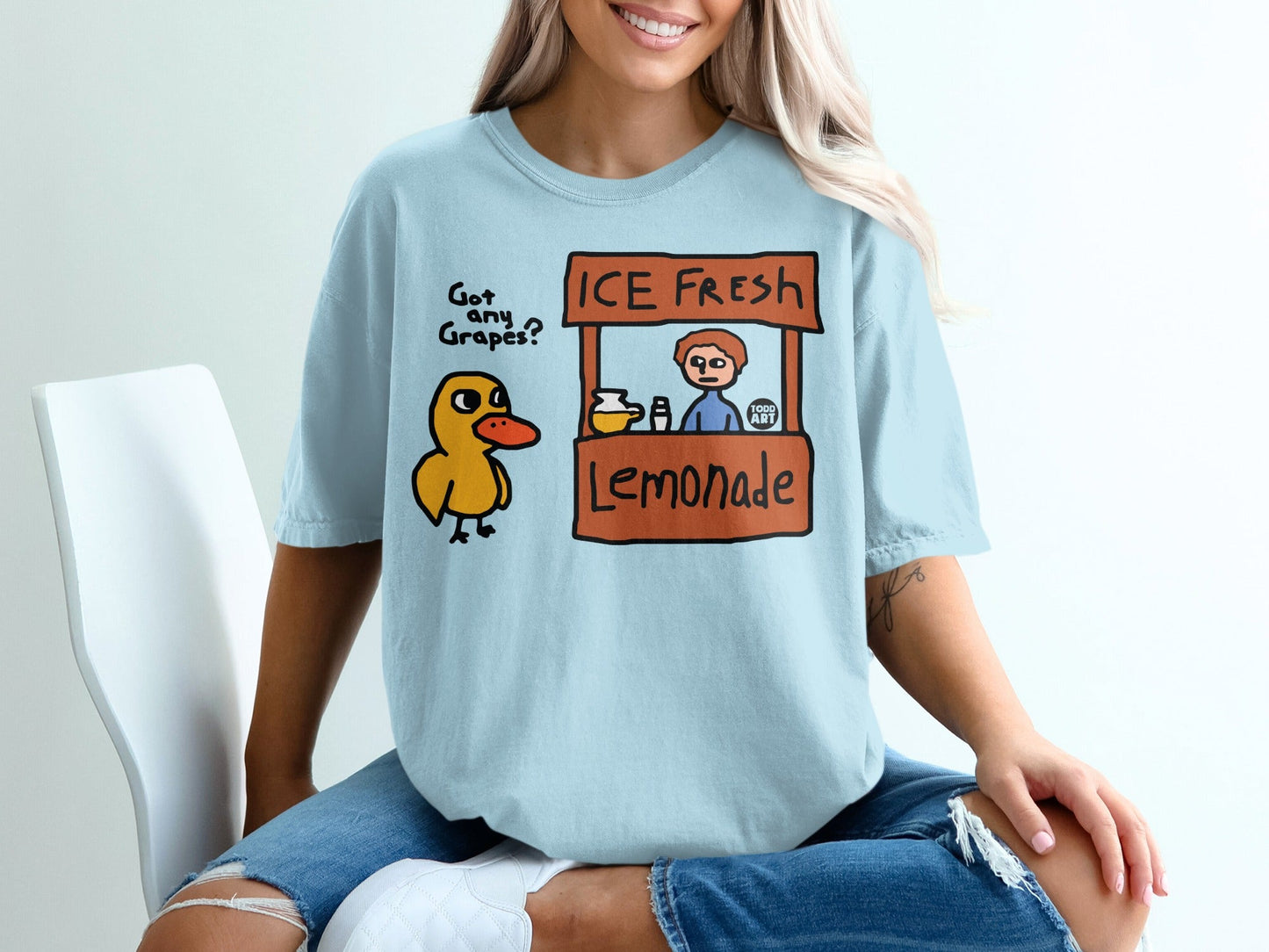 Cartoon duck at an "ICE FRESH Lemonade" stand with handwritten text.