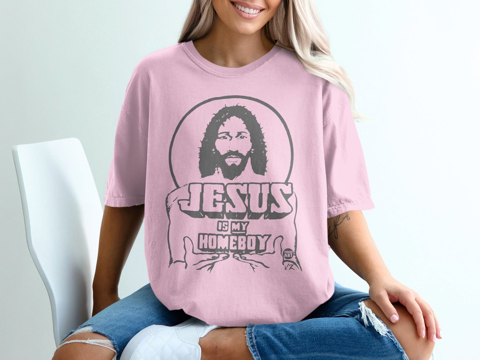 Pink t-shirt with "Jesus is My Homeboy" graphic and a circular portrait of Jesus.