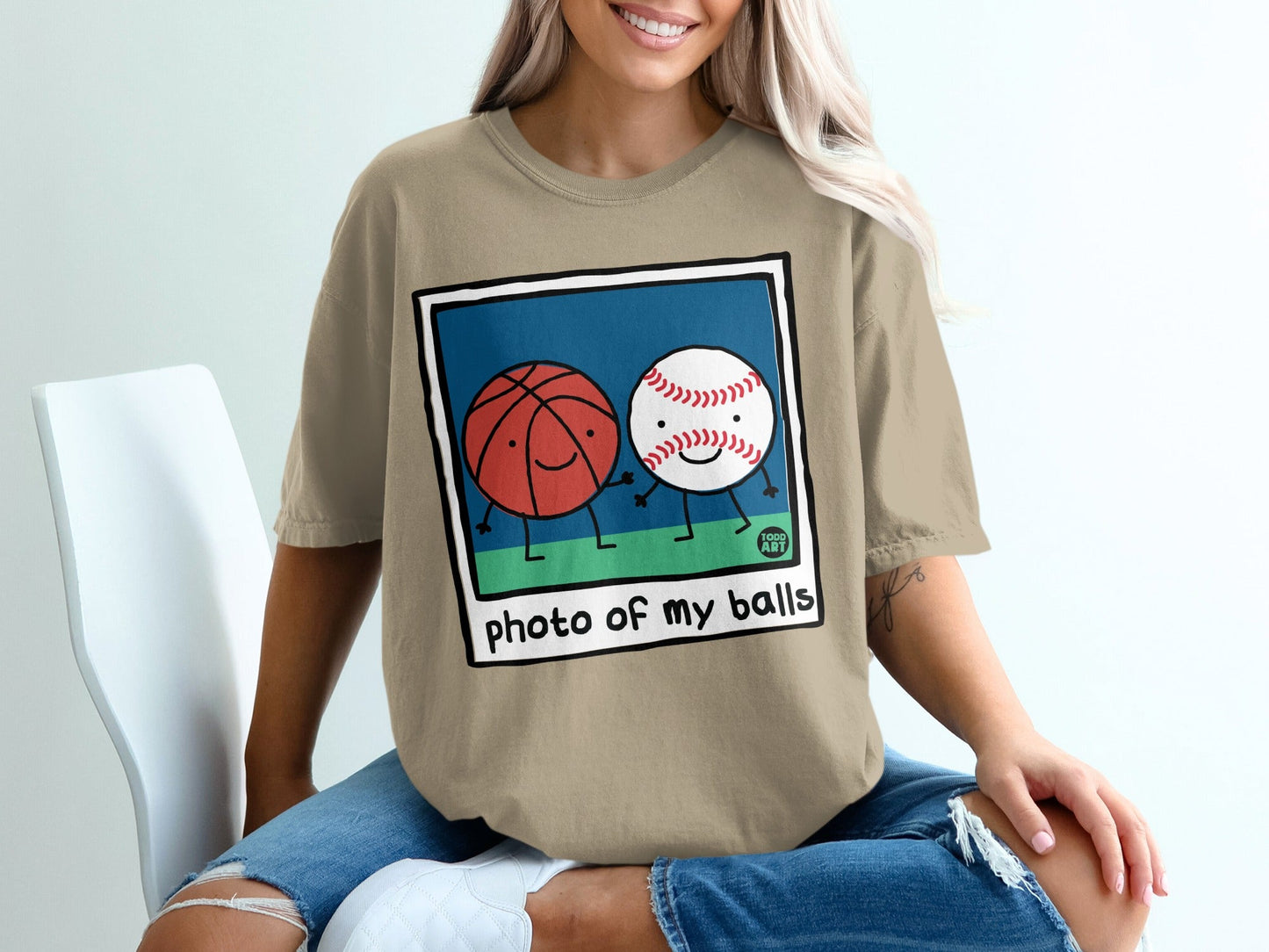 Cartoon basketball and baseball holding hands, with "photo of my balls" text.