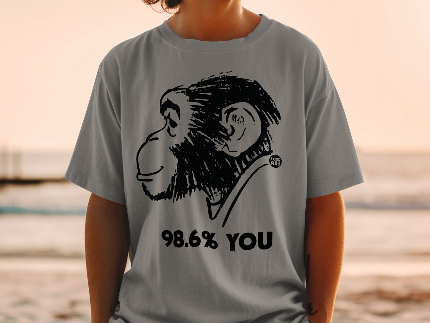 Grey t-shirt with black monkey illustration and "98.6% YOU" text.