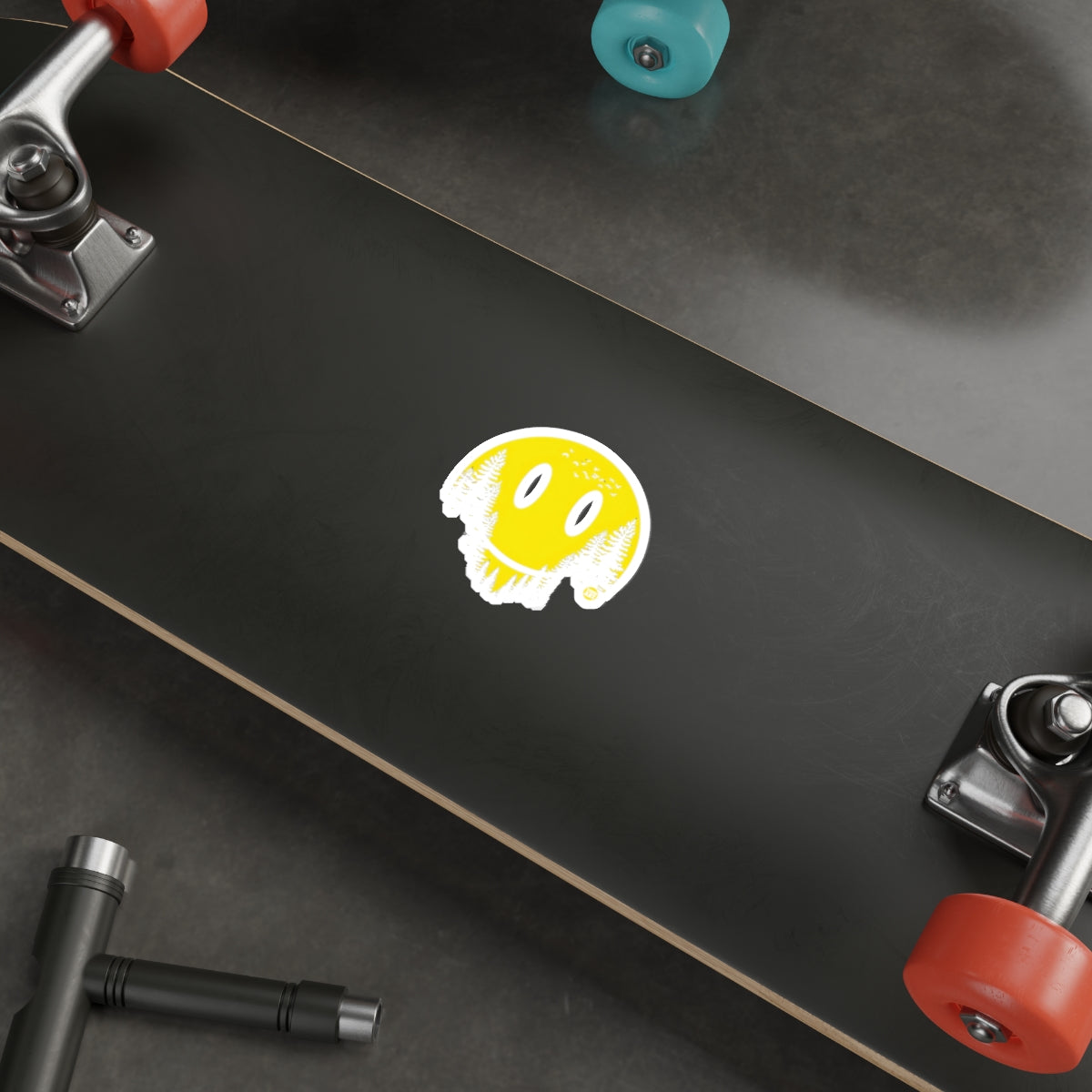 Smiling Yellow Cartoon Face on Black Skateboard Deck