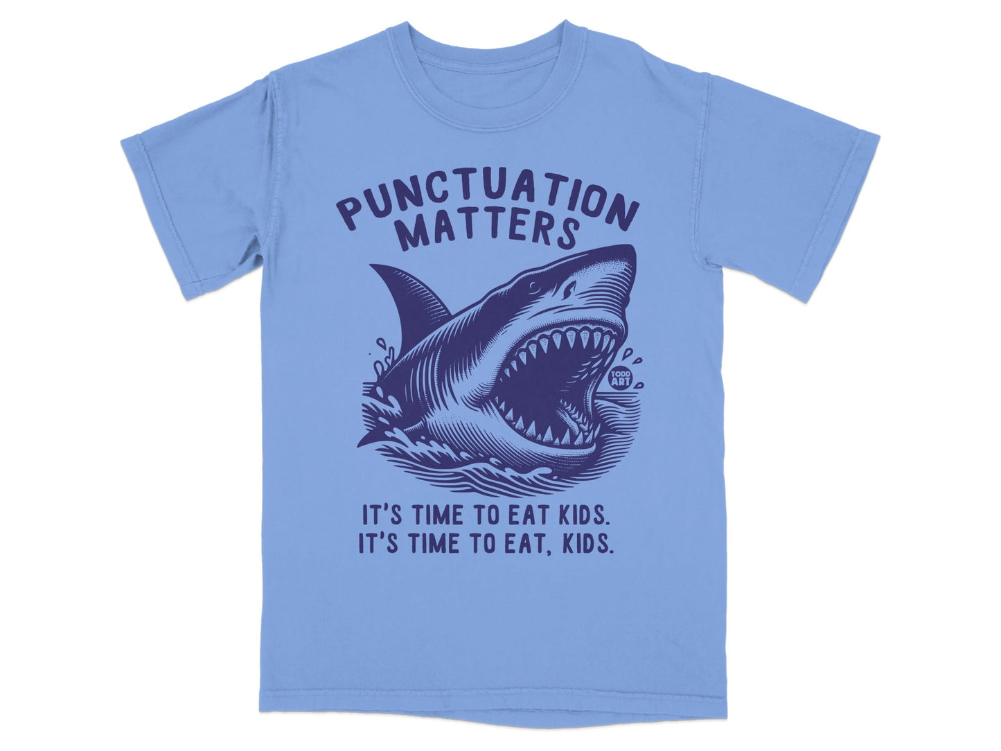 T-shirt with a shark graphic and the text "PUNCTUATION MATTERS. IT'S TIME TO EAT, KIDS. IT'S TIME TO EAT KIDS."