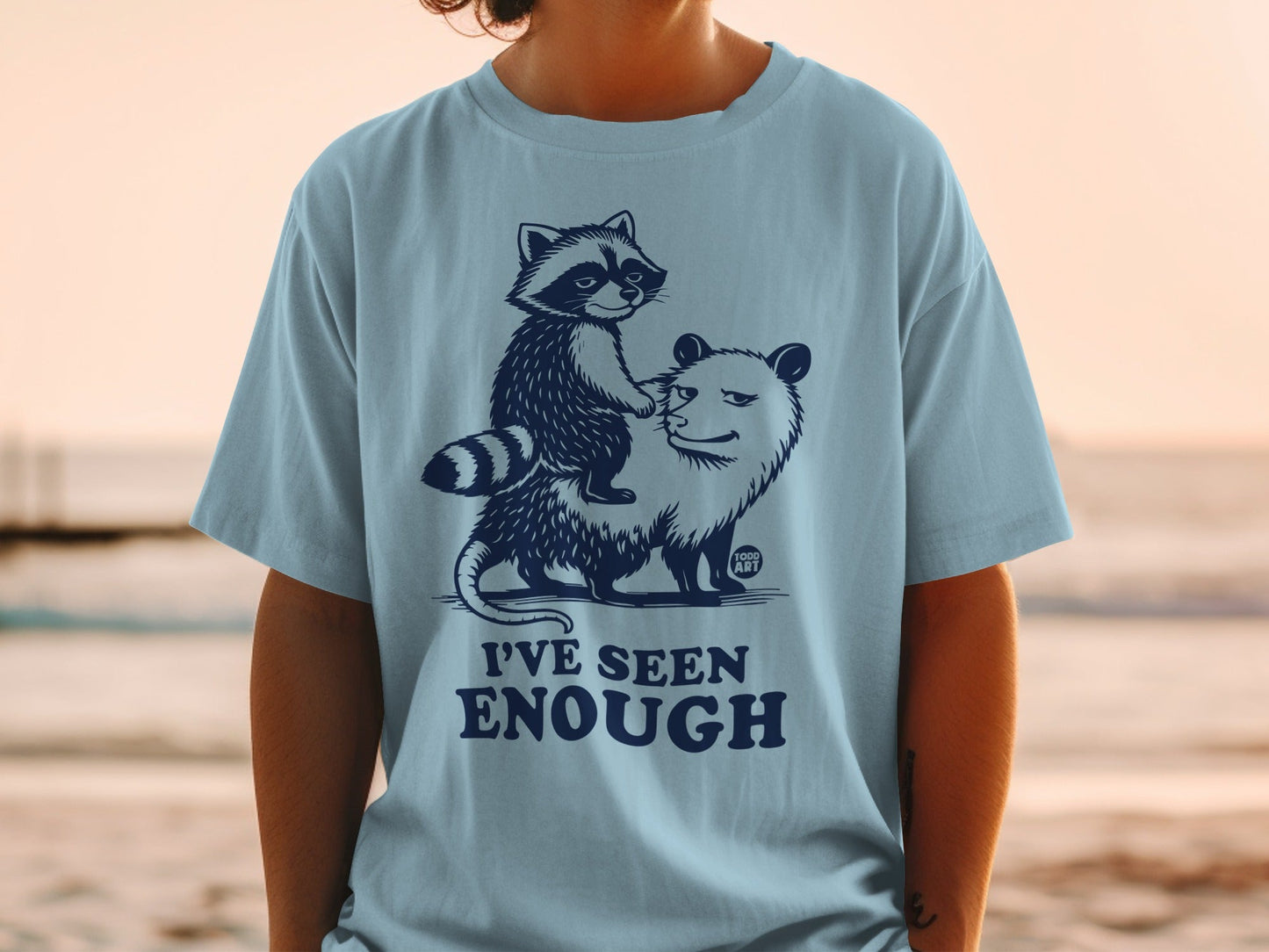 Illustration of a raccoon riding an opossum with text "I'VE SEEN ENOUGH".